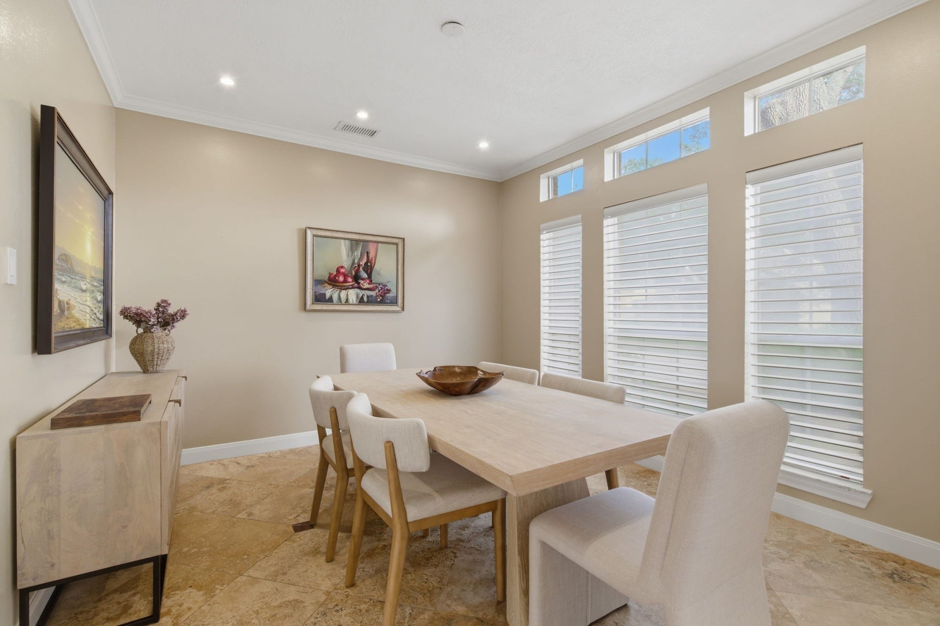 14114 Scarborough Fair Street, Houston, TX 77077 Formal dining designed with custom blinds that extend throughout the entire home along with customizable dimming lighting!