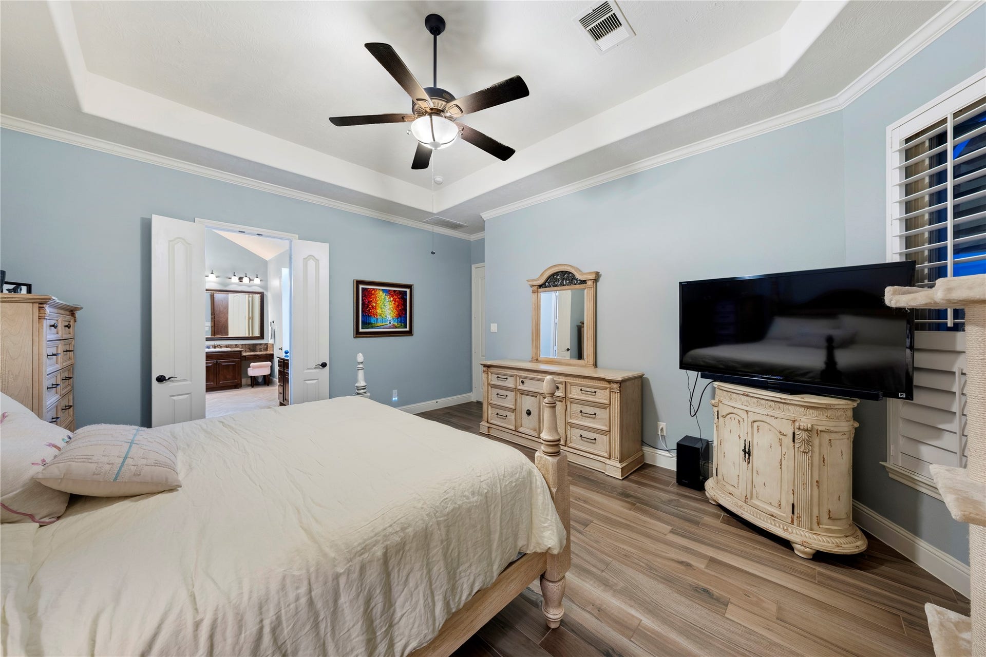 Experience ultimate privacy in the spacious primary bedroom, thoughtfully separated from the secondary bedrooms, creating a serene retreat within your home.