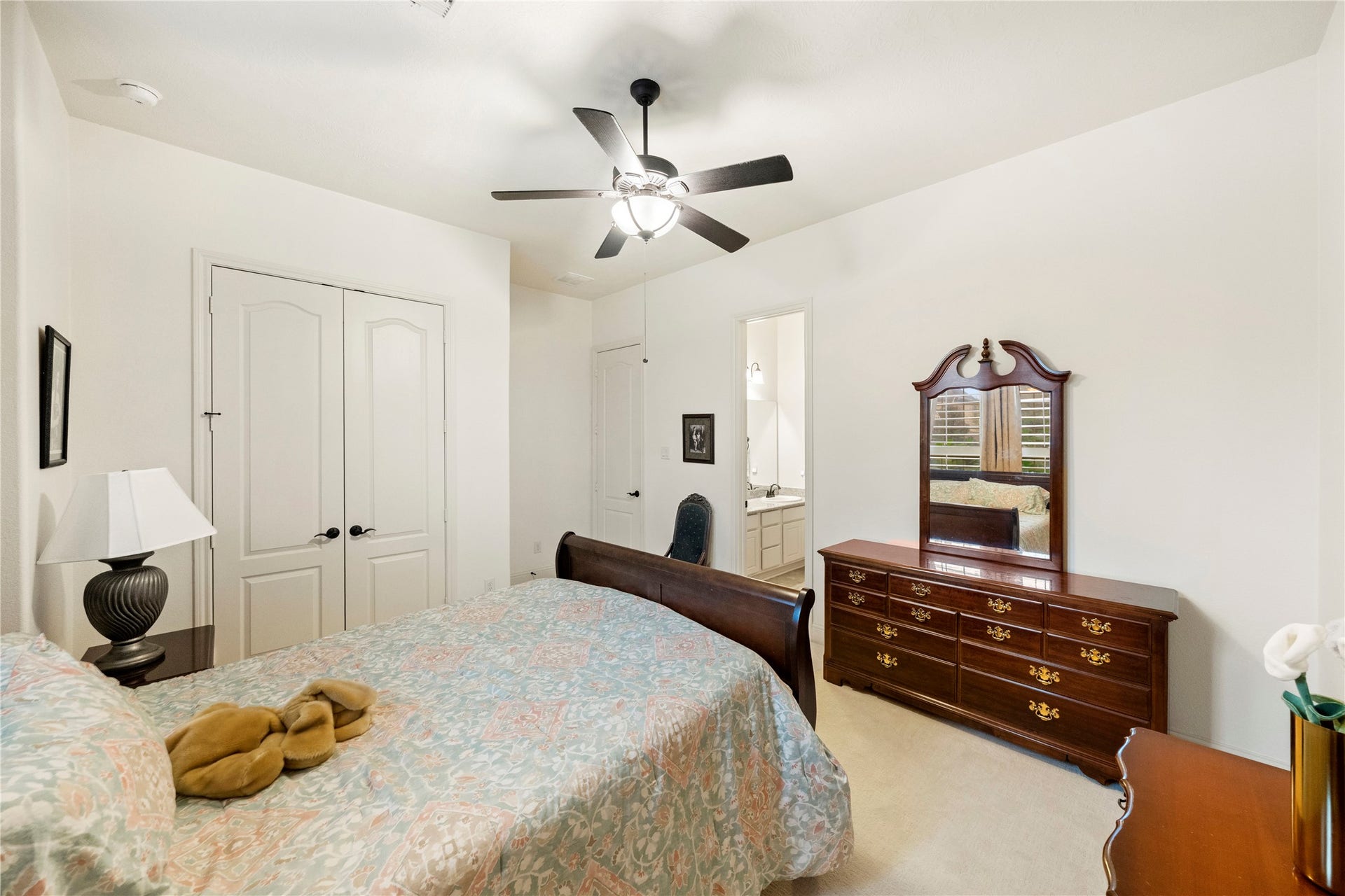 This inviting bedroom connects seamlessly to a Jack and Jill bath, offering convenience and privacy with another adjacent secondary bedroom.