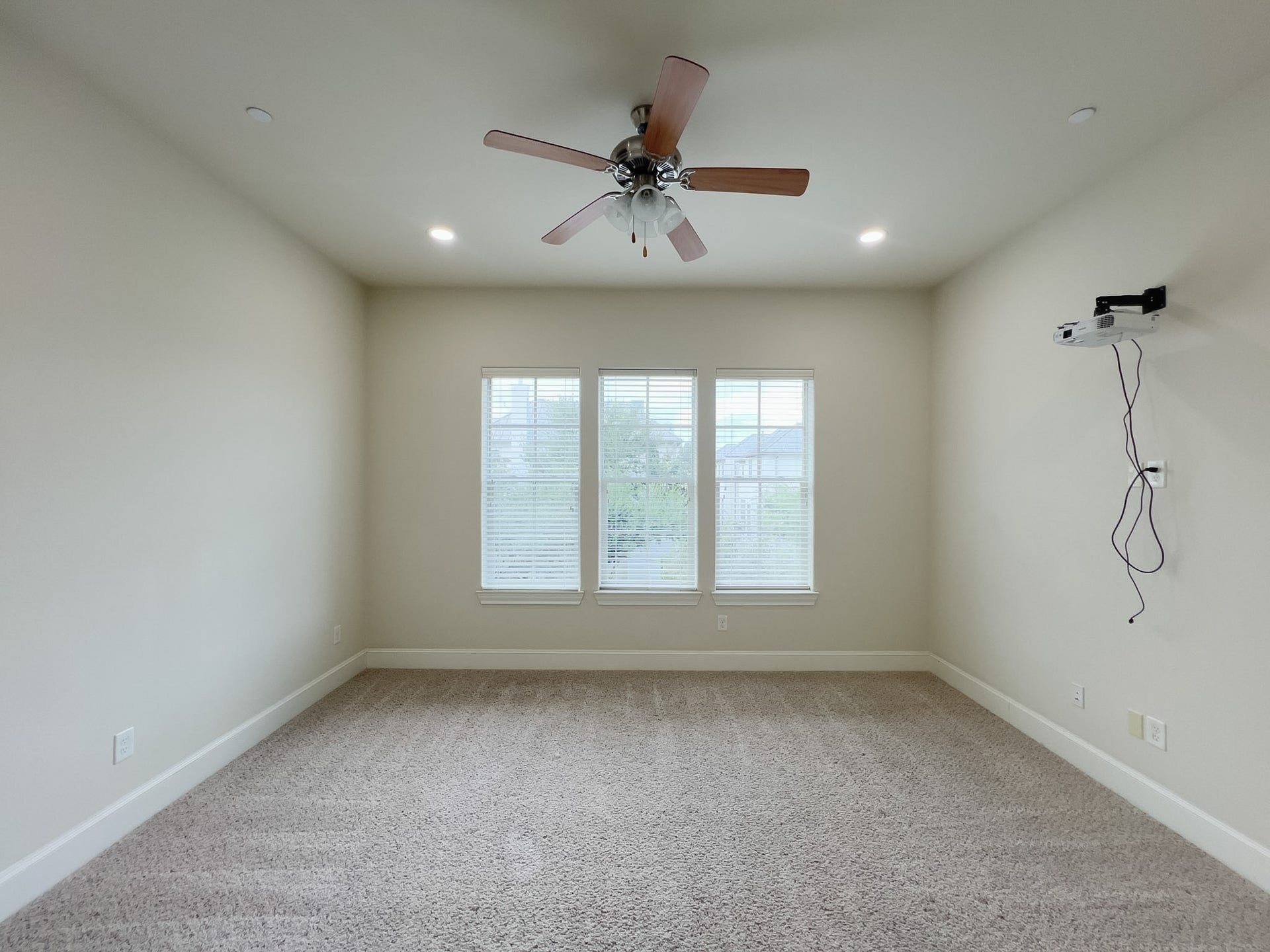 Primary bedroom with projector which can convey if buyer would like.
