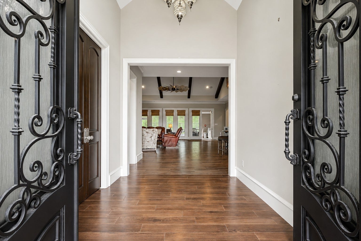 11865 Hope Lane, Magnolia, TX 77354 Step through the grand double front doors into a welcoming foyer that sets the tone for the elegance found throughout the home.
