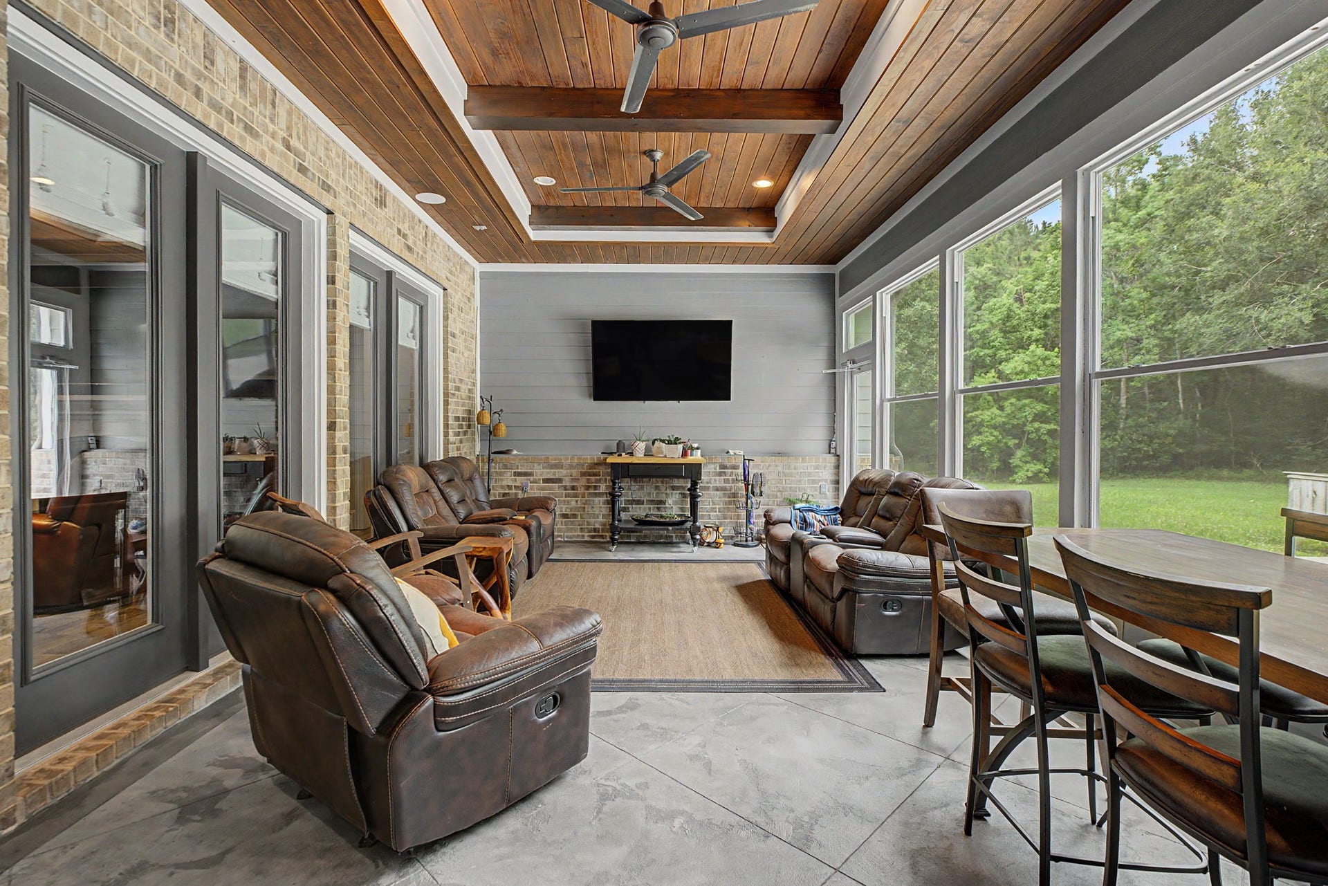 11865 Hope Lane, Magnolia, TX 77354 Another perspective of the sunroom, featuring picturesque views of the backyard and the property's serene setting.