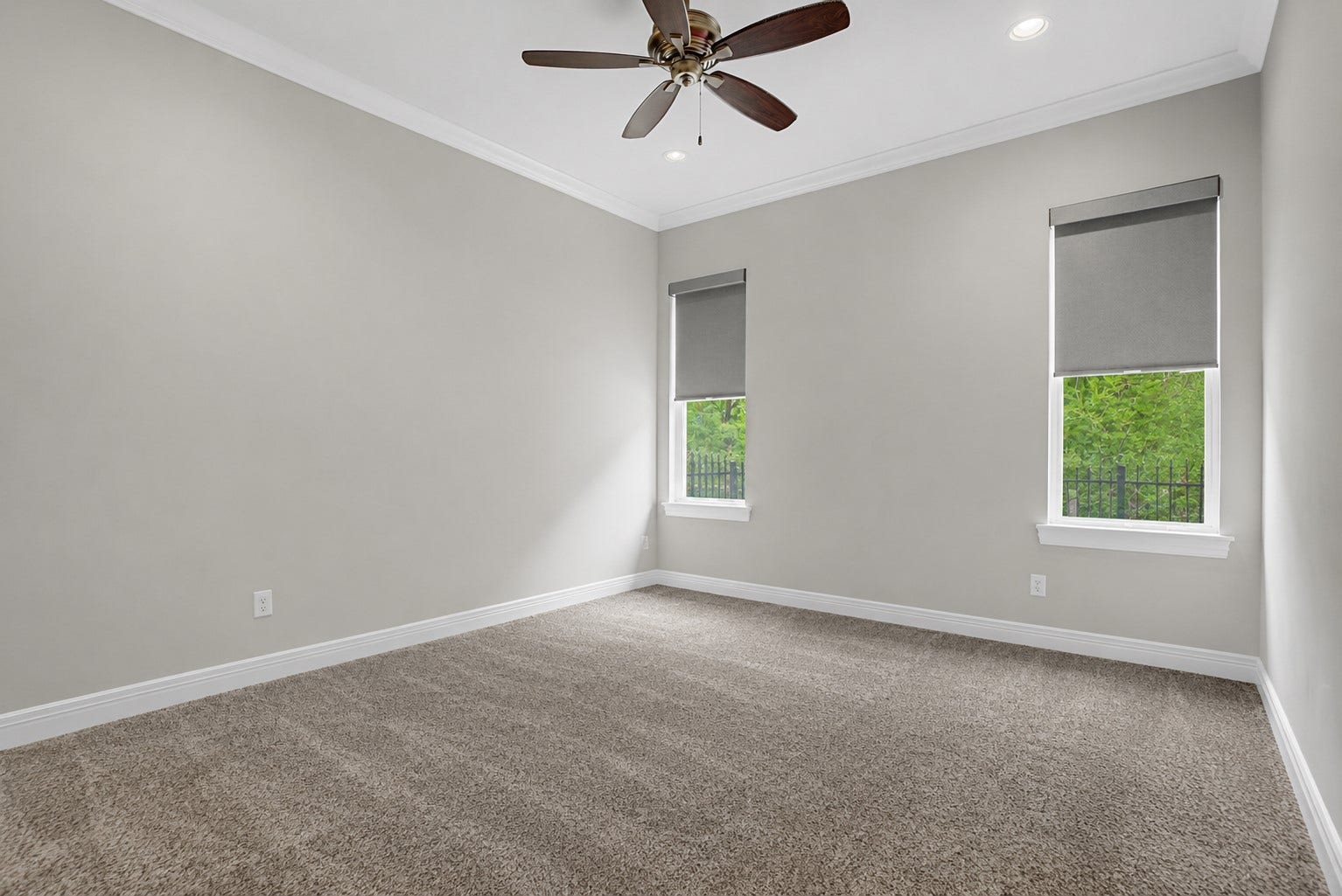 11865 Hope Lane, Magnolia, TX 77354 Abundant natural light pours into Secondary Bedroom #3 through dual windows, enhancing the room's spacious and airy feel.