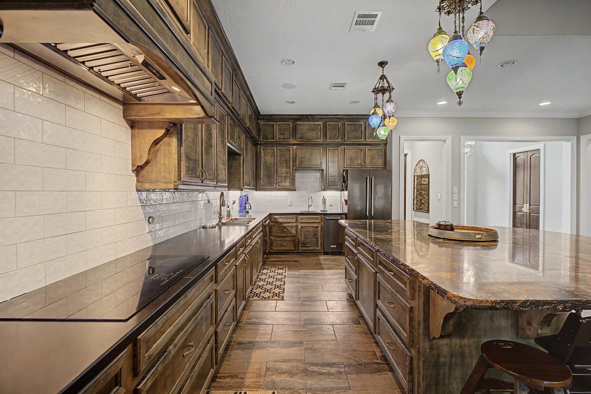 11865 Hope Lane, Magnolia, TX 77354 This view highlights the chef-inspired gourmet kitchen, designed with both functionality and style in mind.