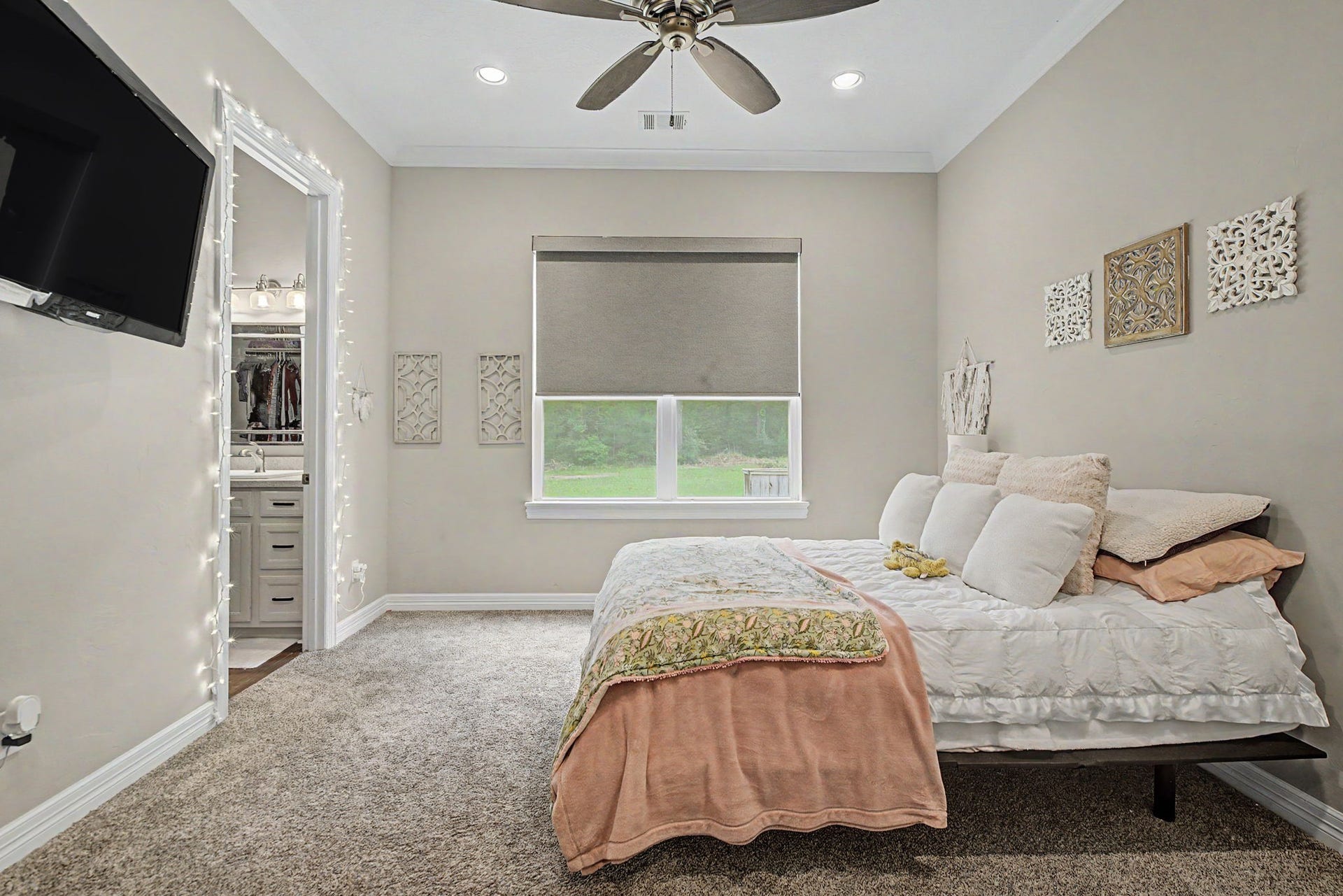 11865 Hope Lane, Magnolia, TX 77354 Bright and welcoming, Secondary Bedroom #2 features an ensuite bathroom, large walk-in closet, and plenty of natural light throughout.