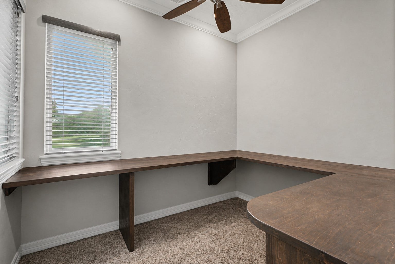 11865 Hope Lane, Magnolia, TX 77354 This unique office space is located within the primary suite's walk-in closet, offering a private and convenient workspace. An additional office is located near the front of the home, providing flexibility for multiple workstations or hobbies.