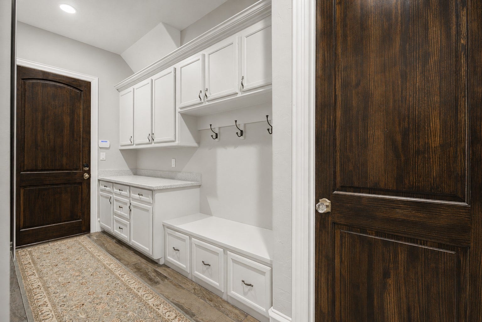11865 Hope Lane, Magnolia, TX 77354 Designed with organization in mind, this spacious mud room provides ample storage and serves as the perfect transition from the garage into the home.