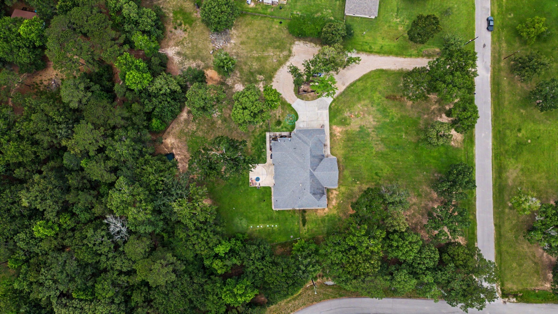 11865 Hope Lane, Magnolia, TX 77354 Aerial view showcasing 5 acres of space, privacy, and endless possibilities.