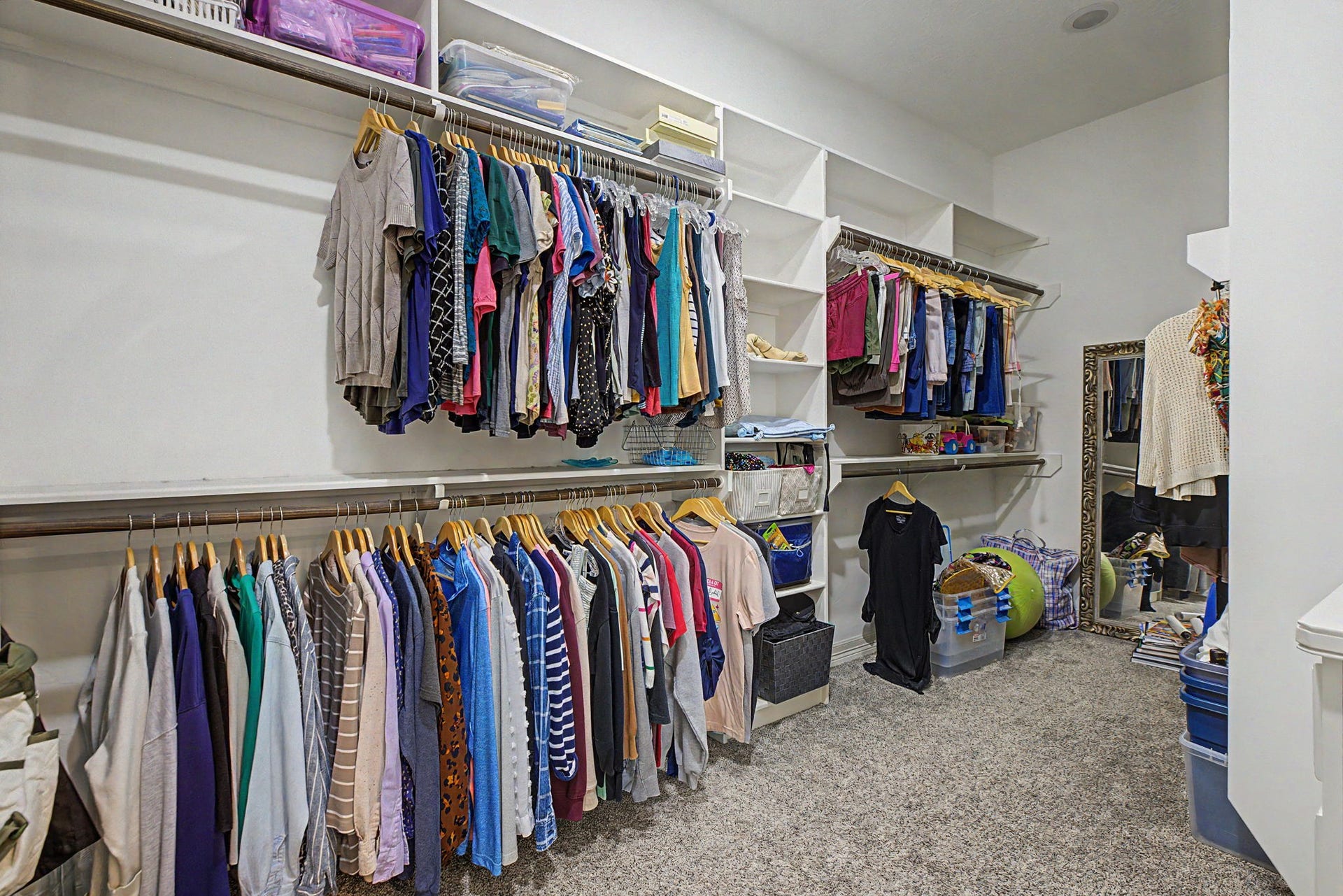 11865 Hope Lane, Magnolia, TX 77354 This spacious walk-in primary closet #1 features custom built-ins, providing exceptional storage and organization.
