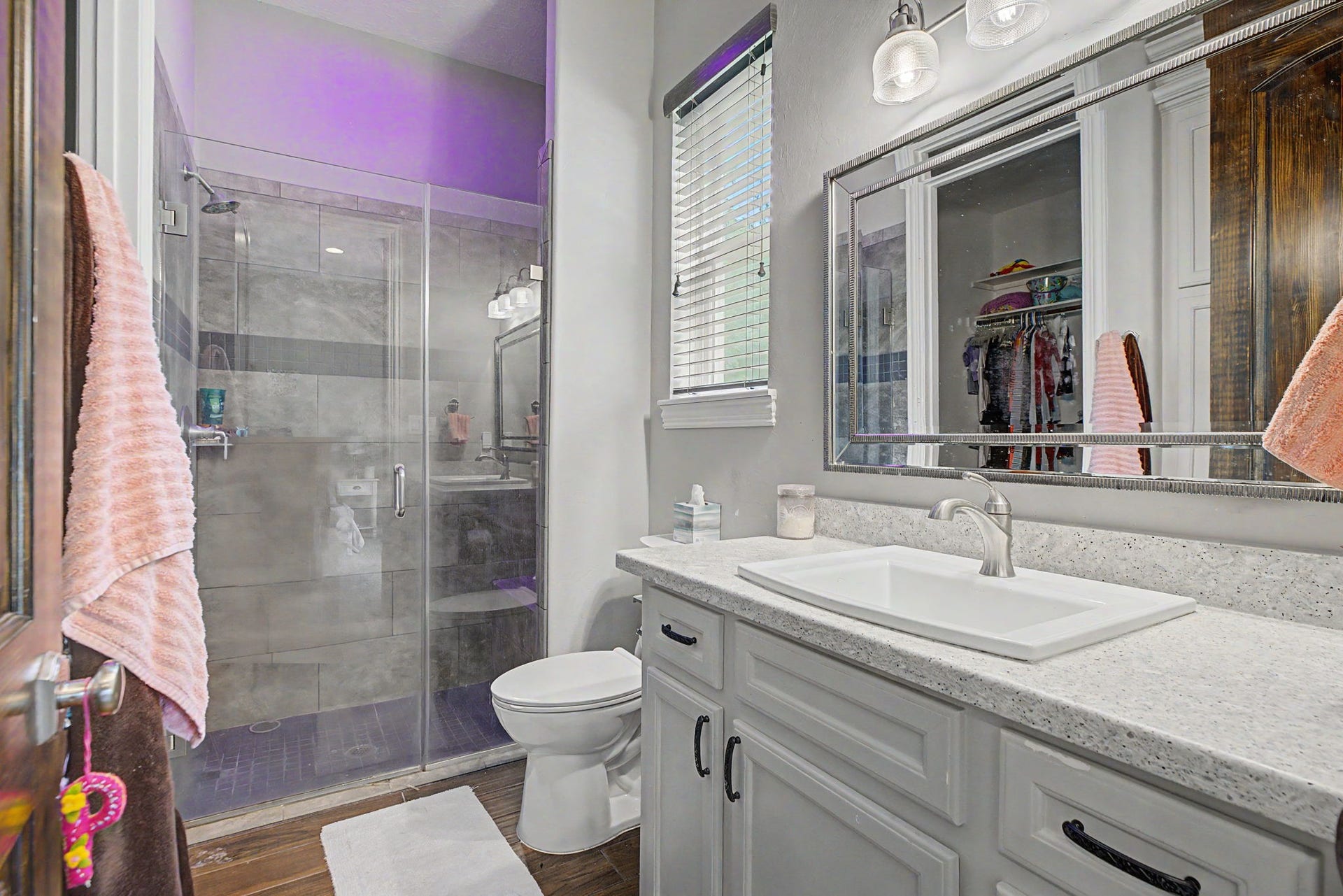 11865 Hope Lane, Magnolia, TX 77354 The ensuite bathroom for Secondary Bedroom #2 features a walk-in shower, neutral finishes, and a timeless design that complements any dcor.