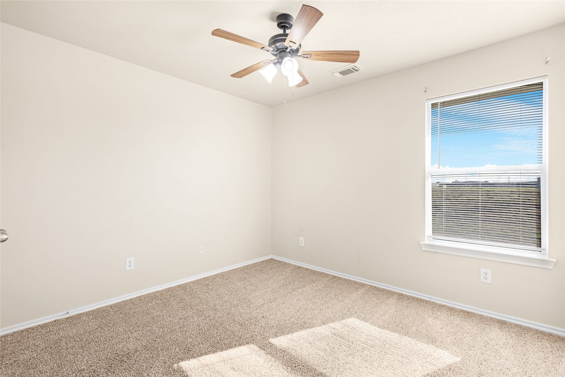 3412 Orchid Trace Lane, Houston, TX 77047 The bright guest bedroom features BRAND NEW, plush carpet, a ceiling fan, and a large window that allows for plenty of natural light
