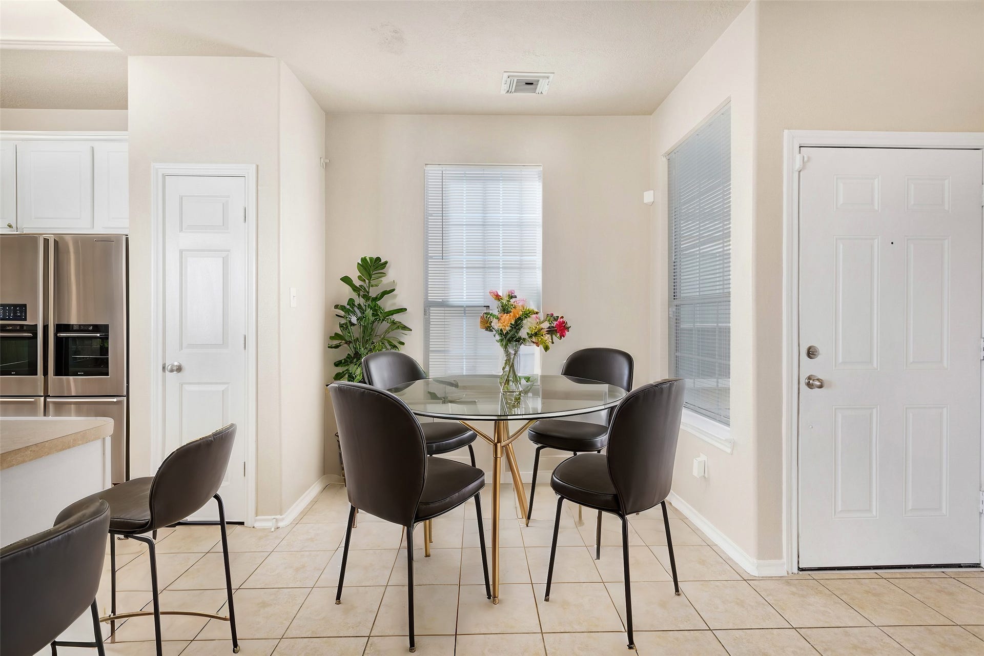 3412 Orchid Trace Lane, Houston, TX 77047 Bright, tiled entryway and breakfast room with two adjacent windows offering plenty of natural light *virtually staged*