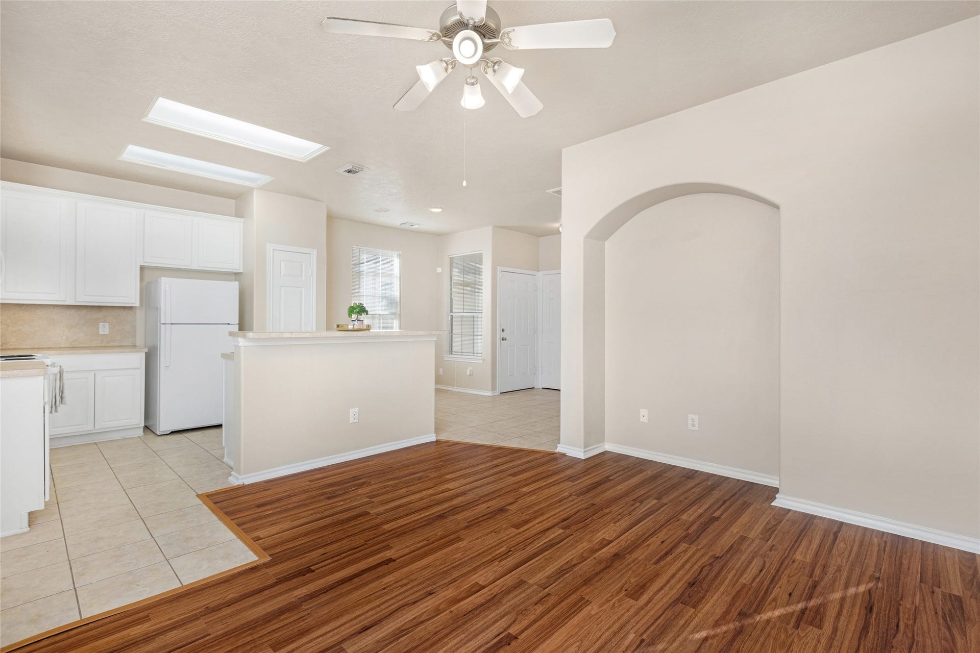 3412 Orchid Trace Lane, Houston, TX 77047 You'll love the bright, open living space with a ceiling fan, blending tile and wood-like flooring