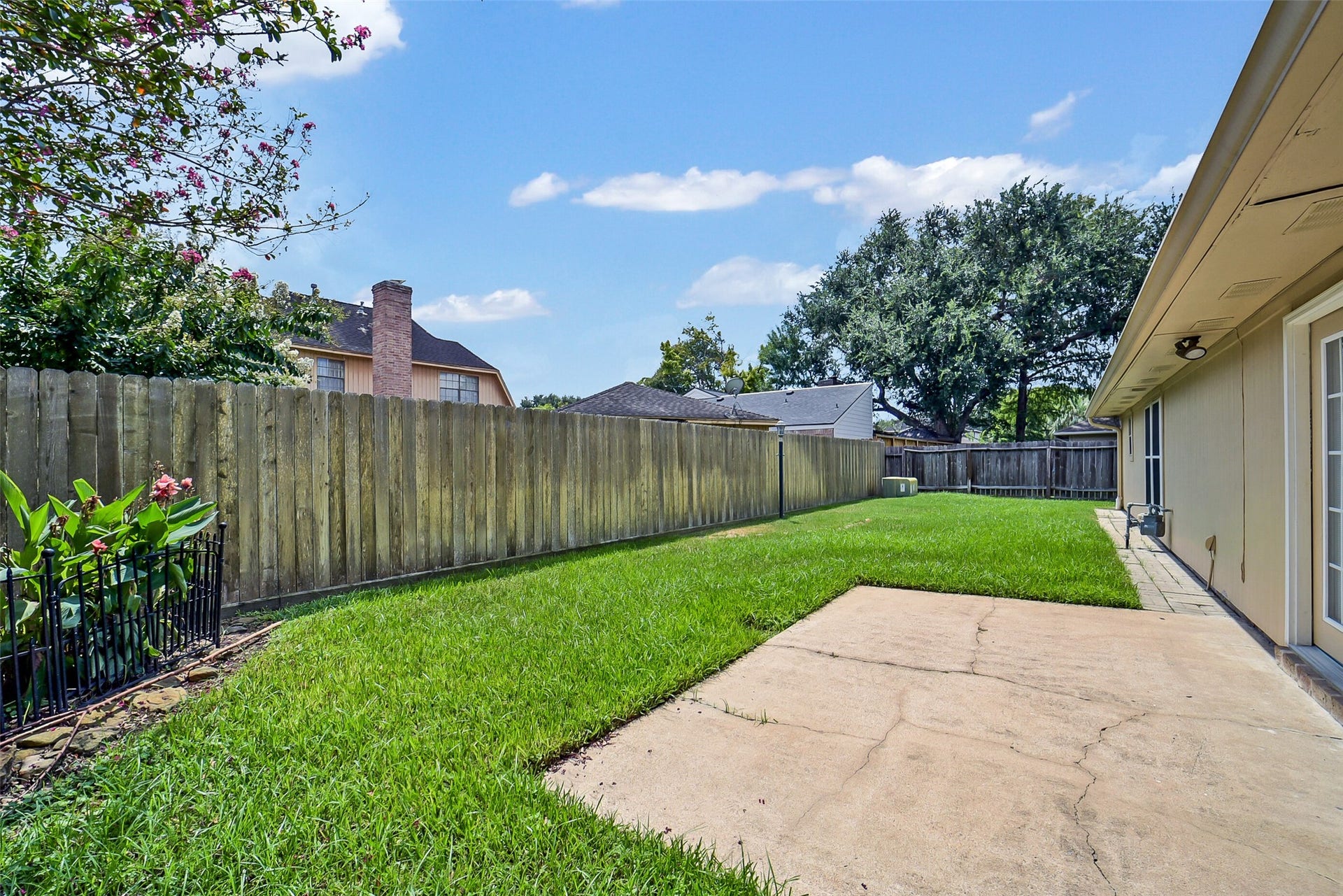 Out back is a patio and plenty of green space.