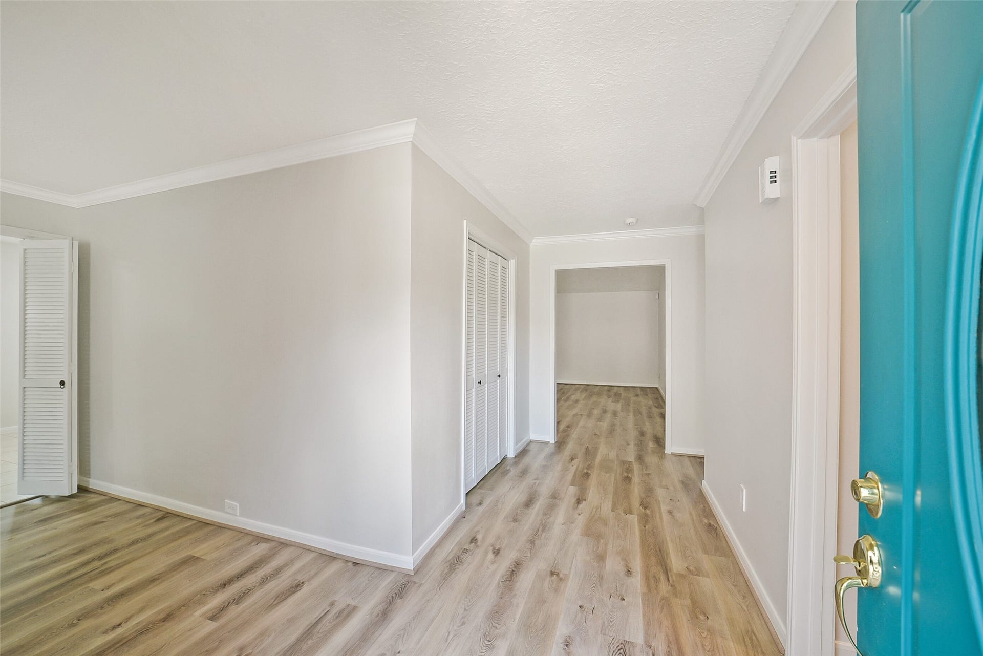 Welcome home! As you enter the home you are greeted by high end laminate floors.