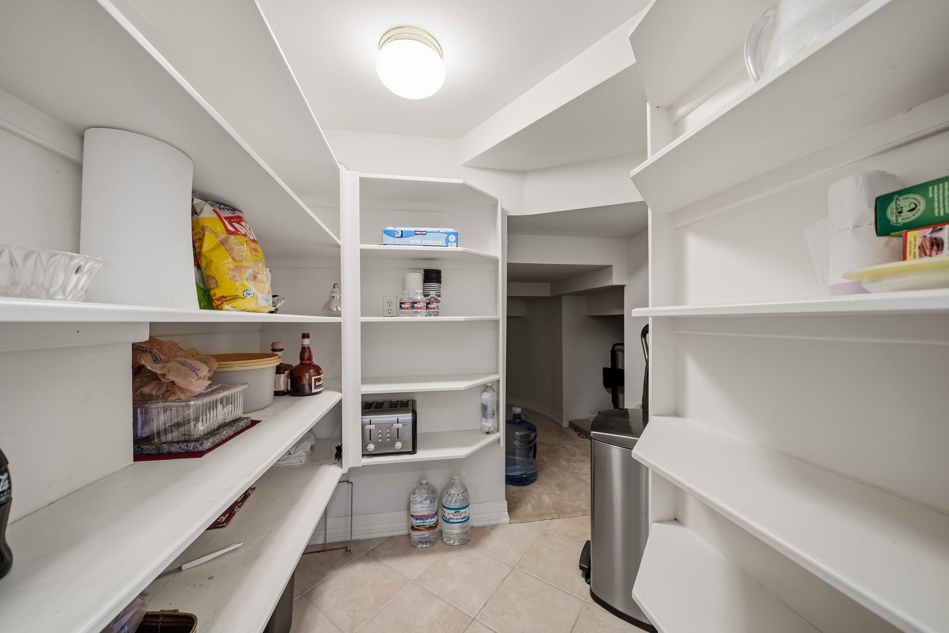 The walk-in kitchen pantry with additional storage.