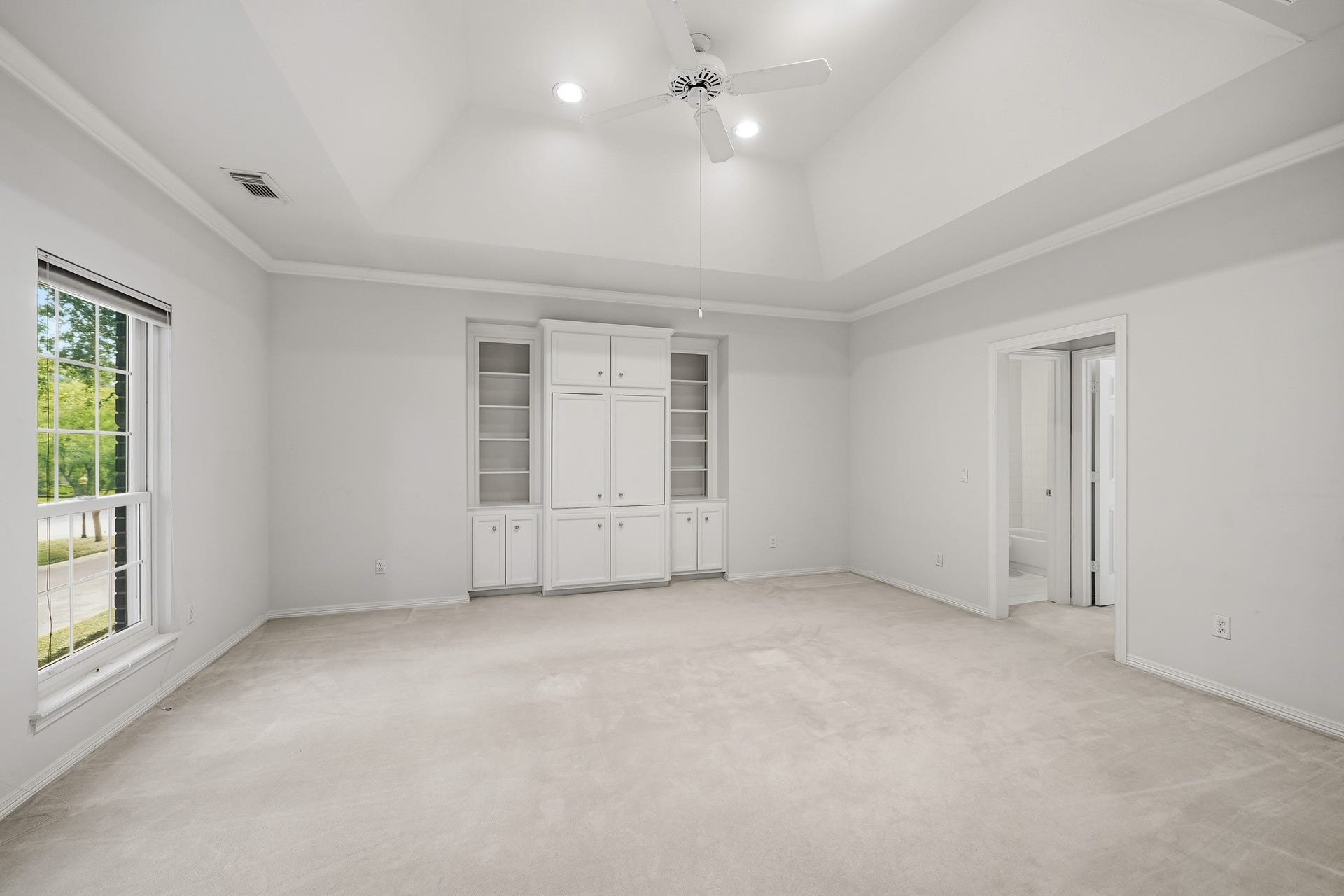 The upstairs game room with built-in shelving. Plenty of room for a pool table, game tables or maybe a large comfy couch for movie night.