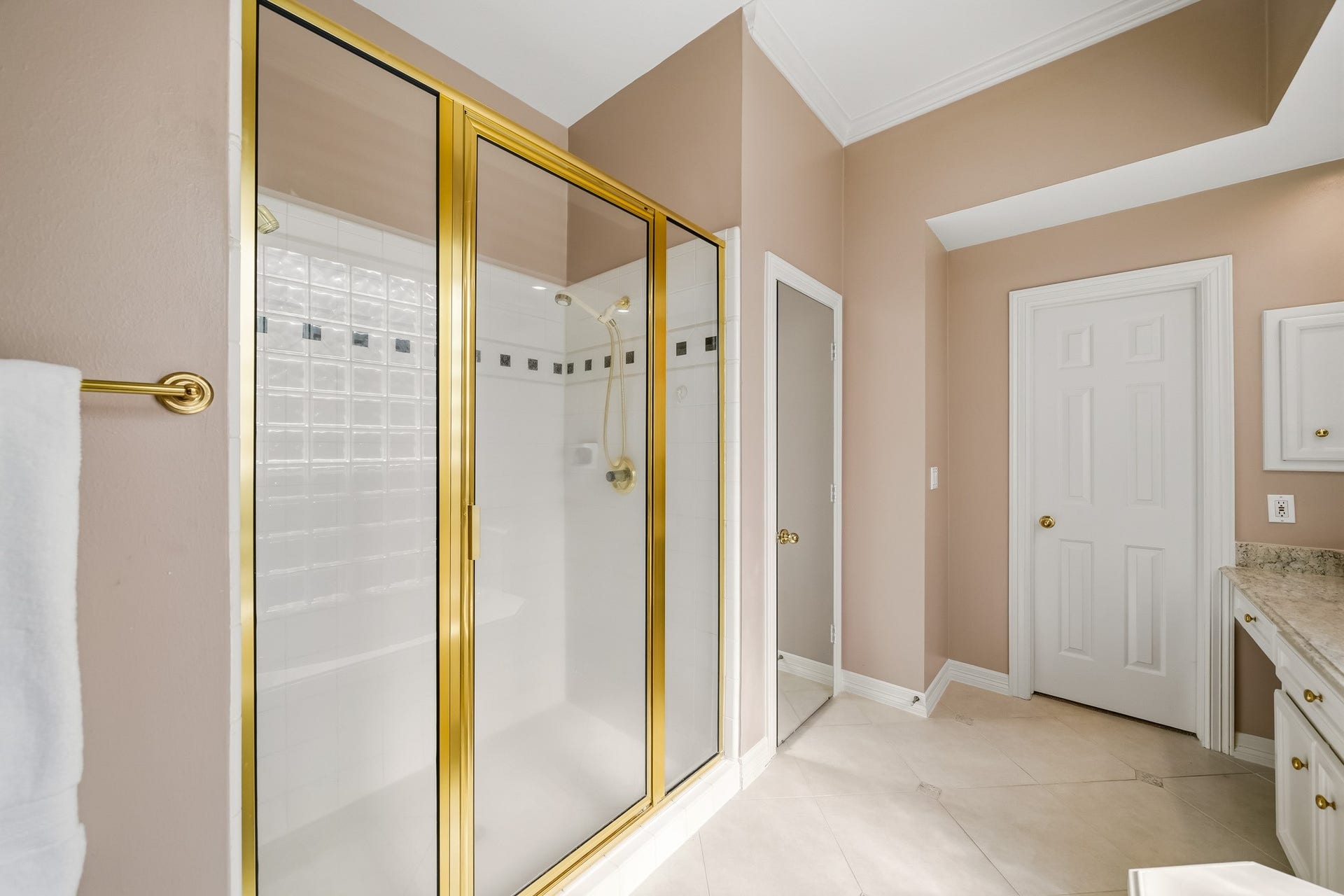The spacious shower and private water closet.