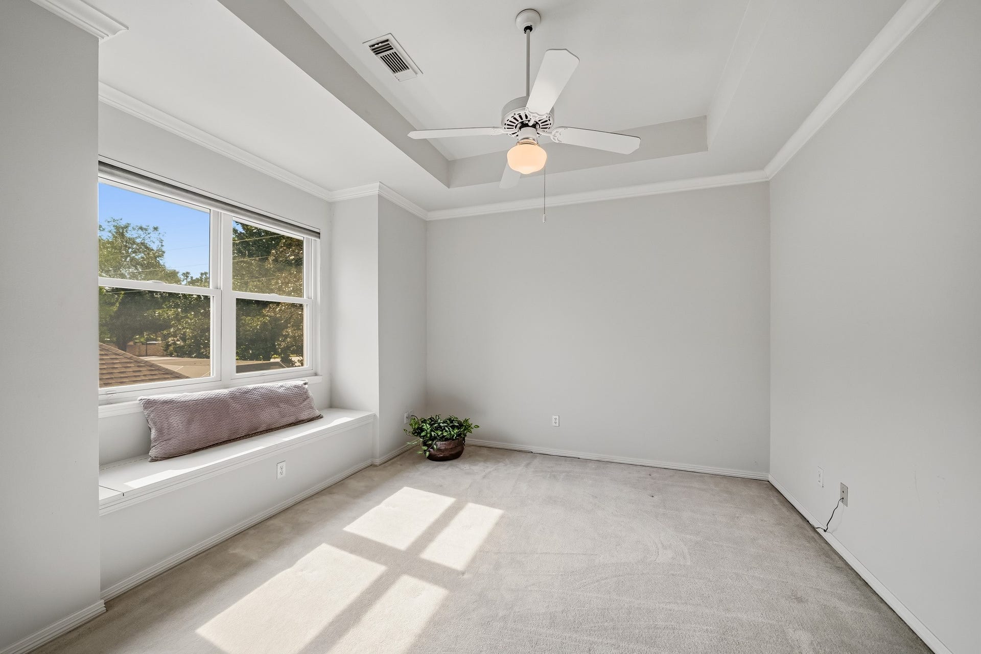 Bedroom 2 upstairs. Very spacious and a window nook with storage.