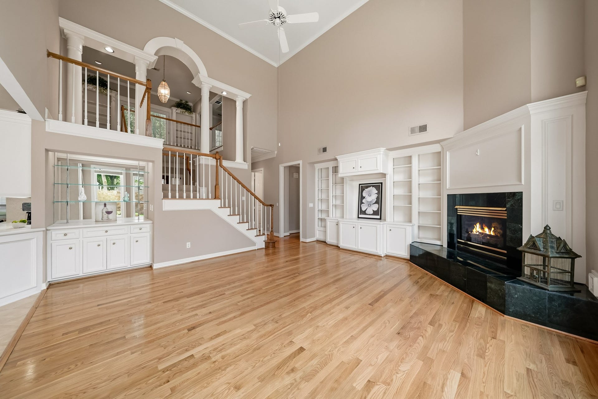 The dramatic dual staircase provides upstairs access from the family room.