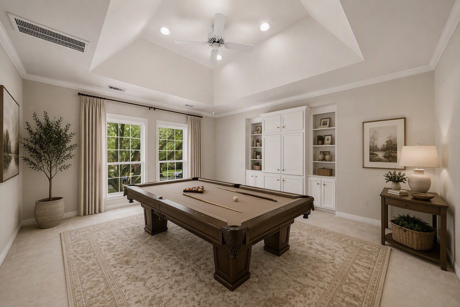 The game room (virually staged) with coffered ceiling, ceiling fan and recessed lighting.