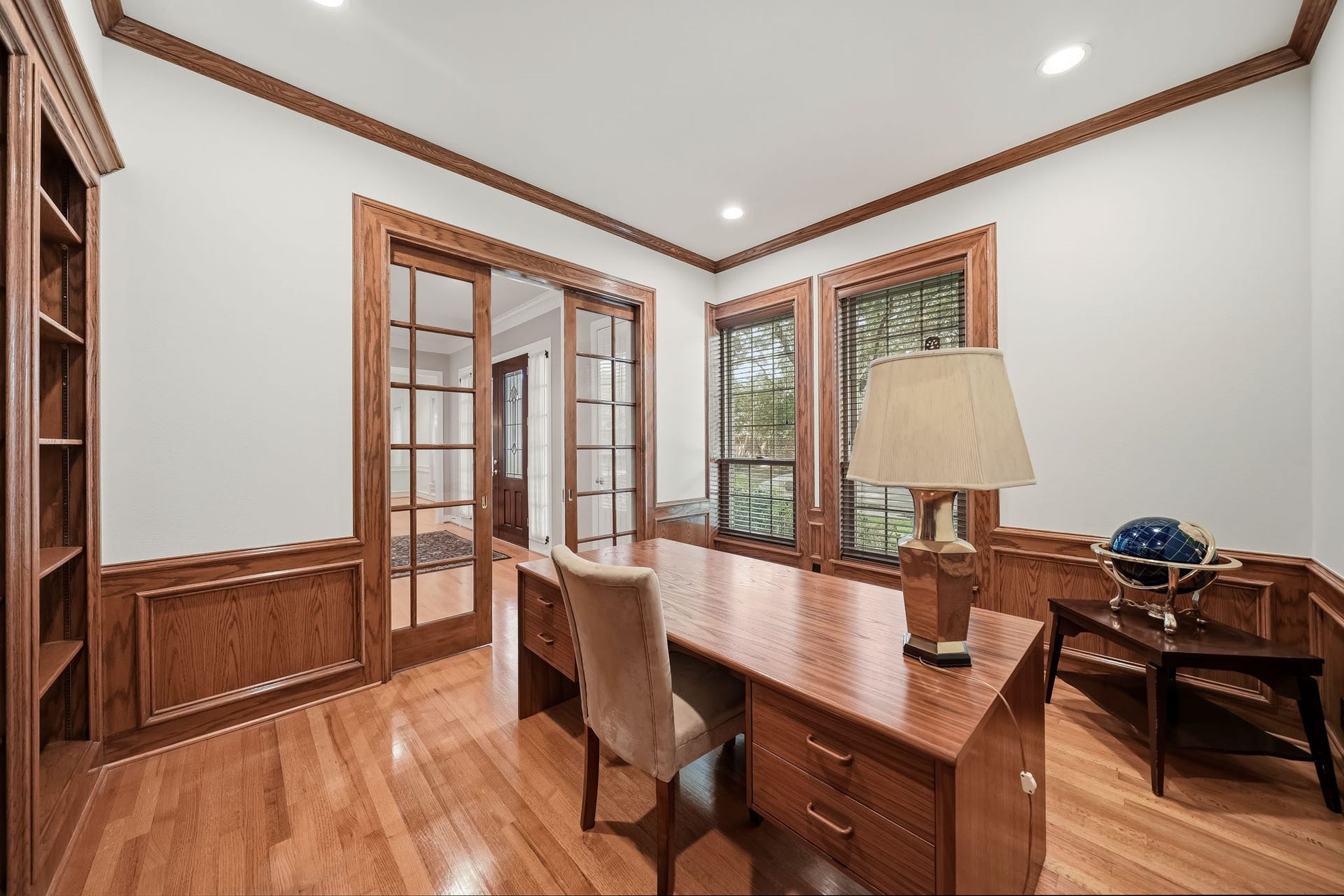 Intricate wood detailing, recently painted walls, and classic hardwood flooring; this space provides a private and tranquil area for work or study.