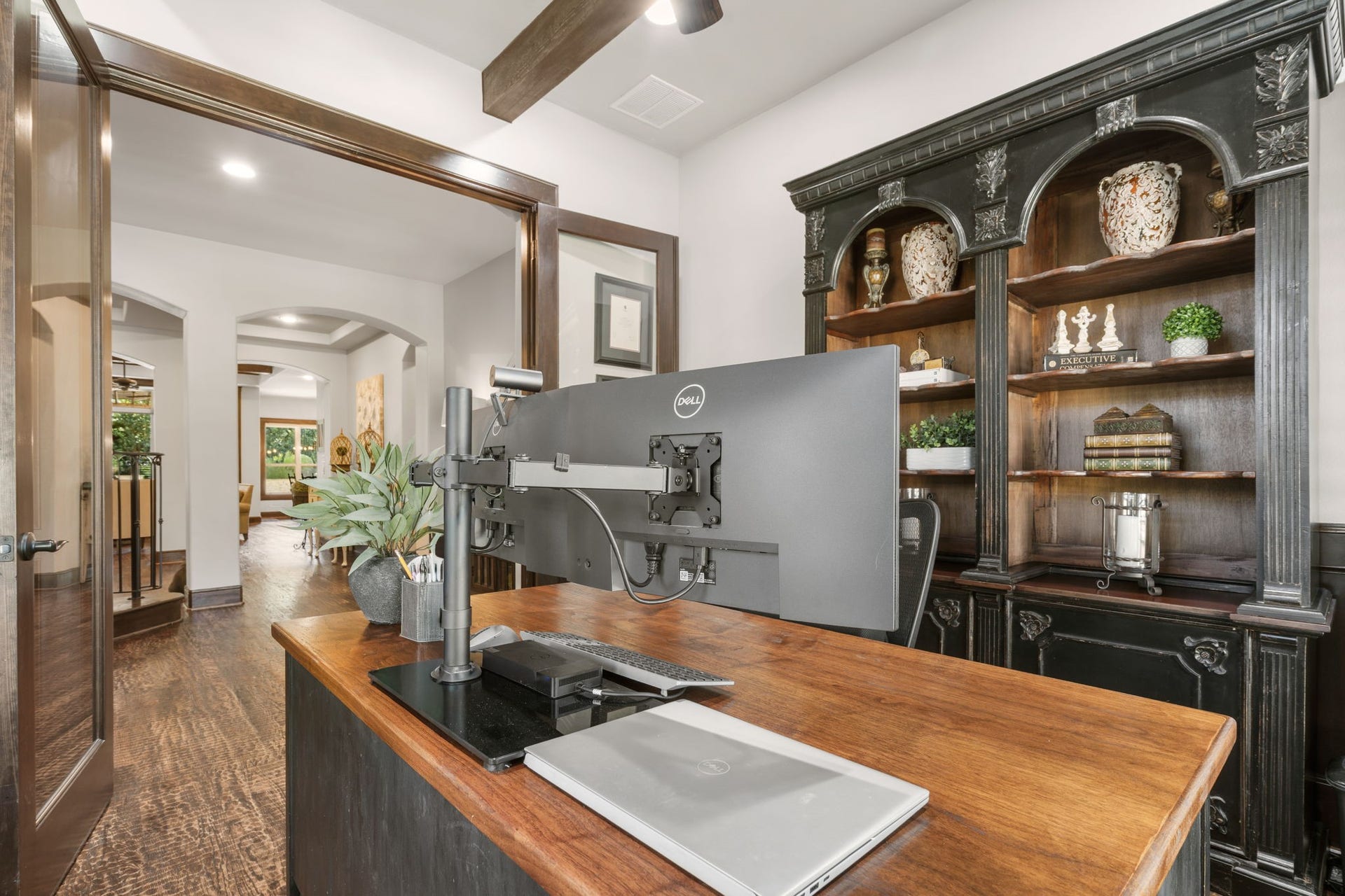 126 Summer Holly Drive, Conroe, TX 77384 Rich wood wainscoting and beautiful architectural details create a sophisticated setting for working from home.