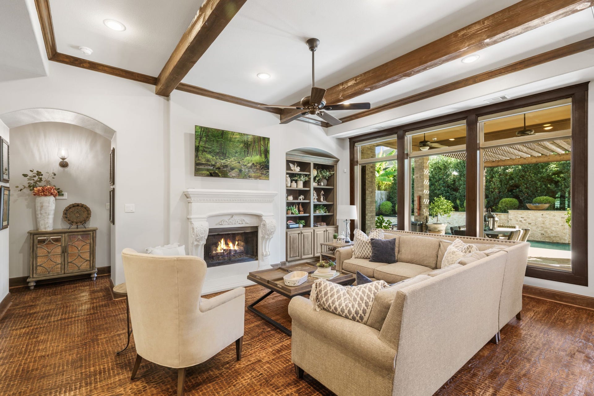 126 Summer Holly Drive, Conroe, TX 77384 Oversized windows frame beautiful views of the backyard oasis, bringing natural light and outdoor scenery into the living space.