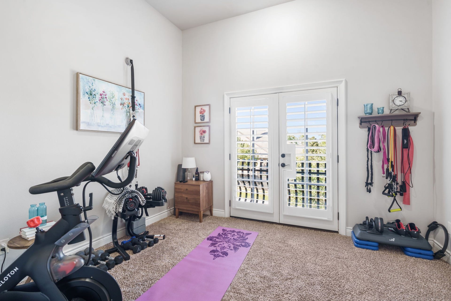 126 Summer Holly Drive, Conroe, TX 77384 Versatile upstairs bedroom featuring high ceilings and French doors opening to a private balcony.