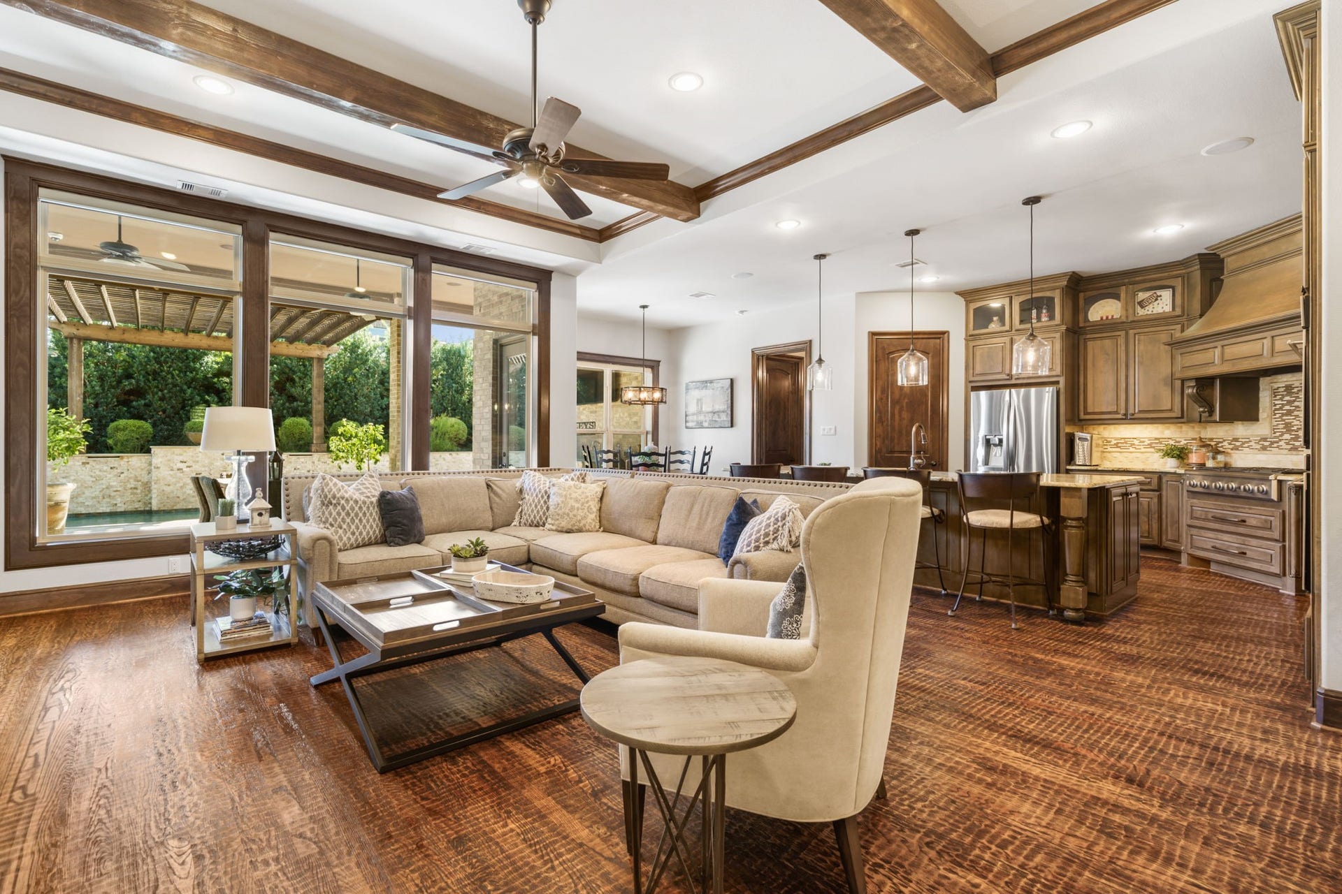 126 Summer Holly Drive, Conroe, TX 77384 Expansive open-concept living area seamlessly connects the family room, kitchen, and breakfast area, creating an ideal space for everyday living and entertaining.