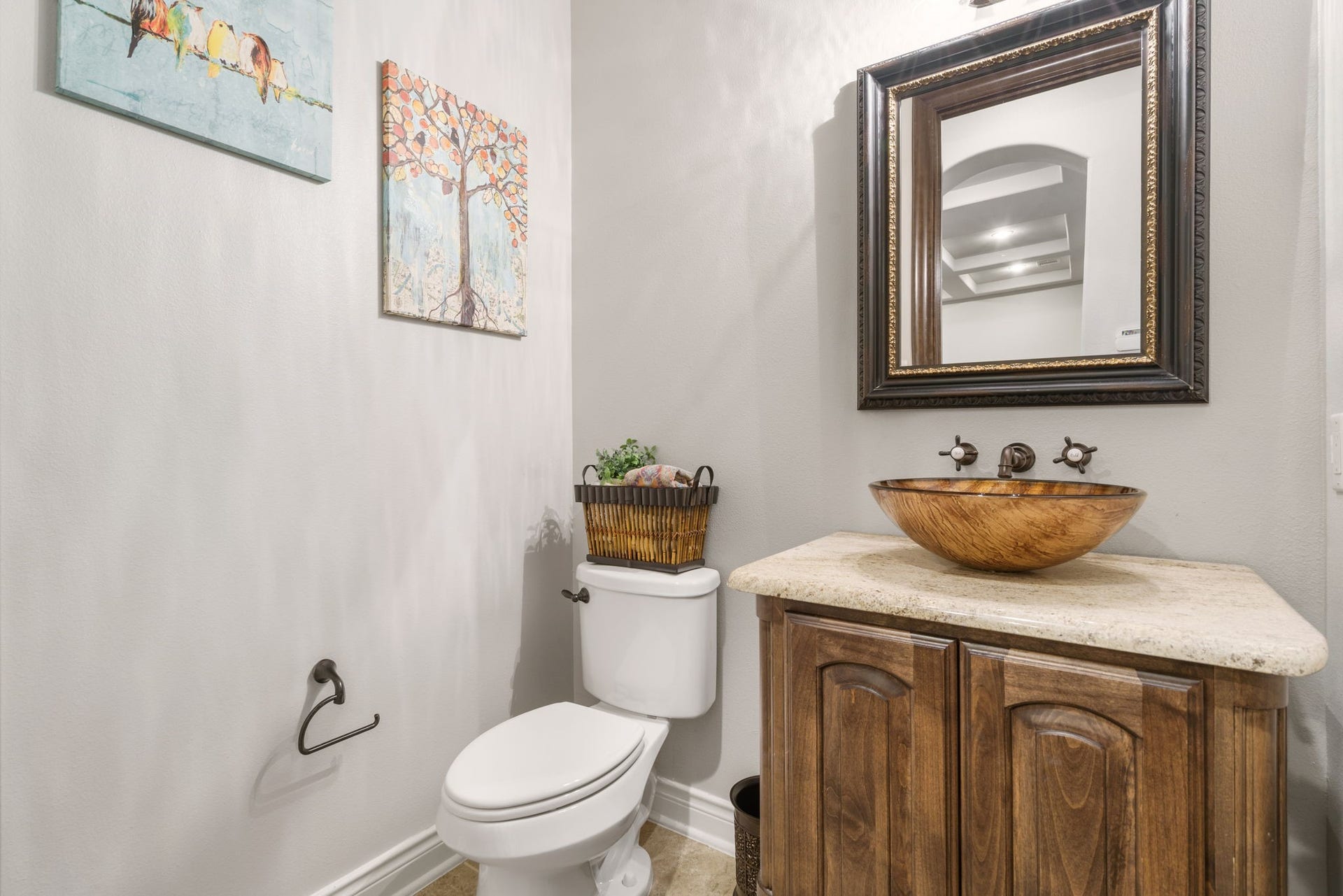 126 Summer Holly Drive, Conroe, TX 77384 Charming powder bath featuring a decorative vessel sink, granite countertop, and wall-mounted faucet.