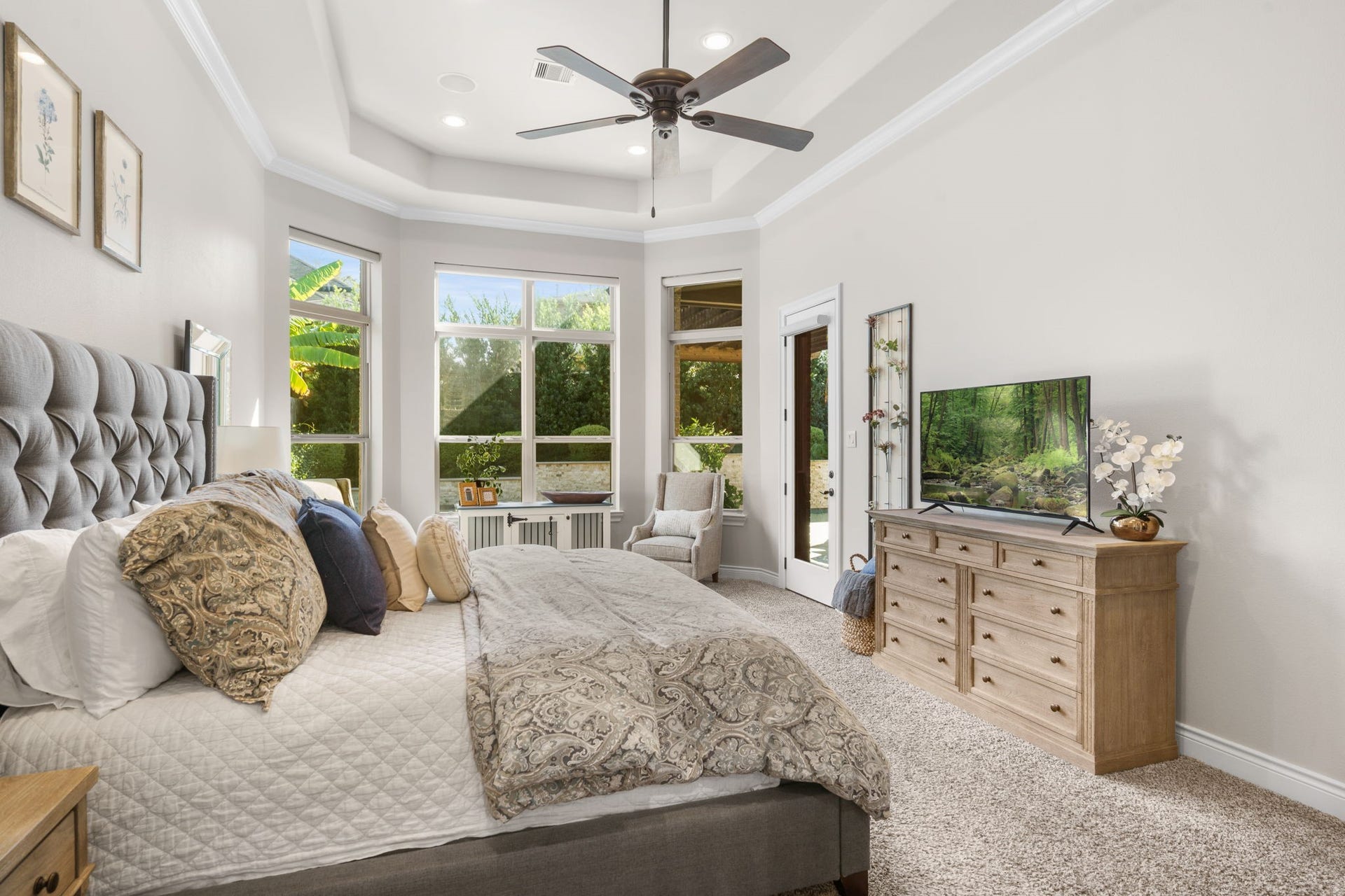 126 Summer Holly Drive, Conroe, TX 77384 A peaceful sitting area surrounded by windows offers the perfect place to unwind.