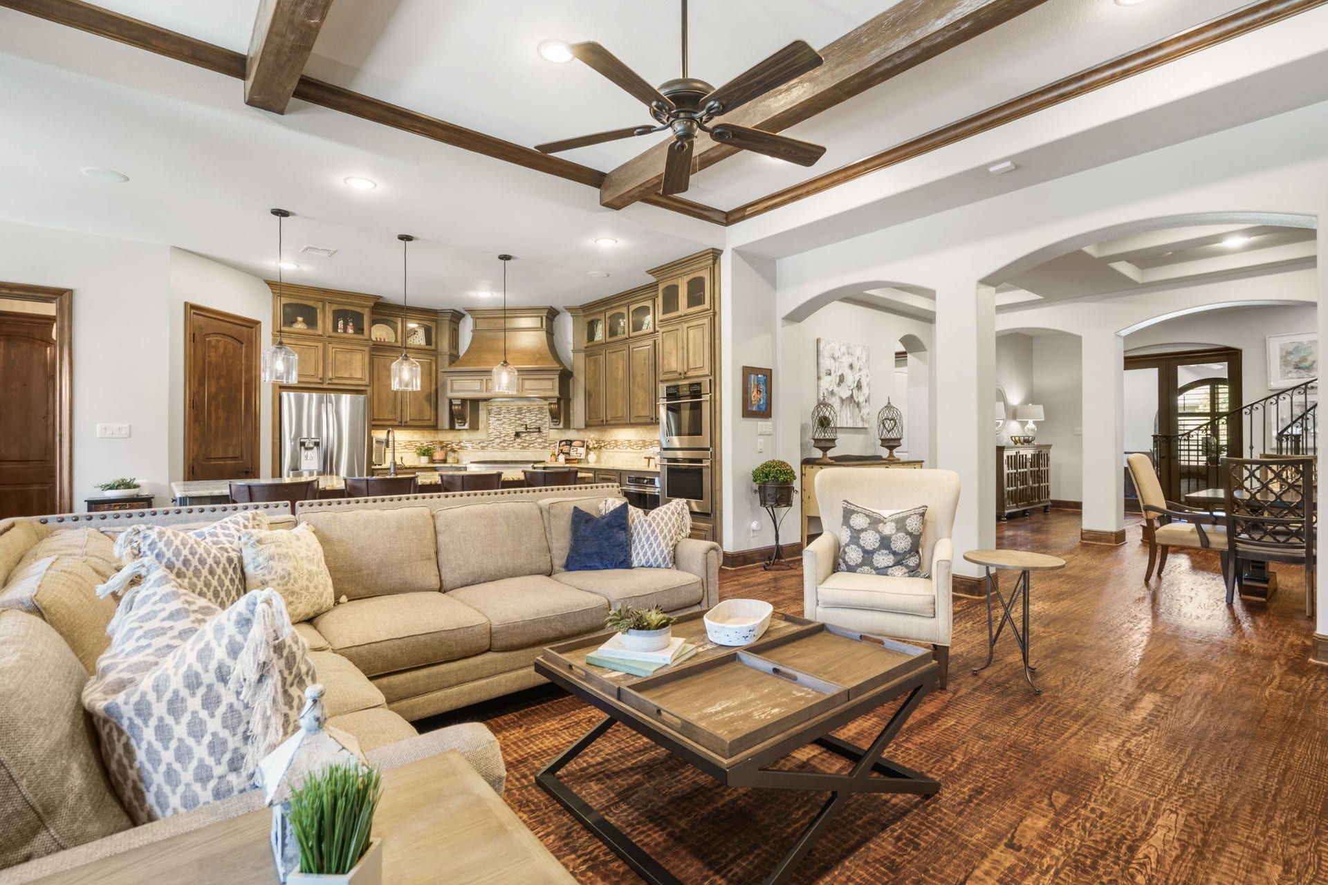 126 Summer Holly Drive, Conroe, TX 77384 Impressive ceiling beams and rich hardwood flooring add warmth and architectural character to the spacious family room.