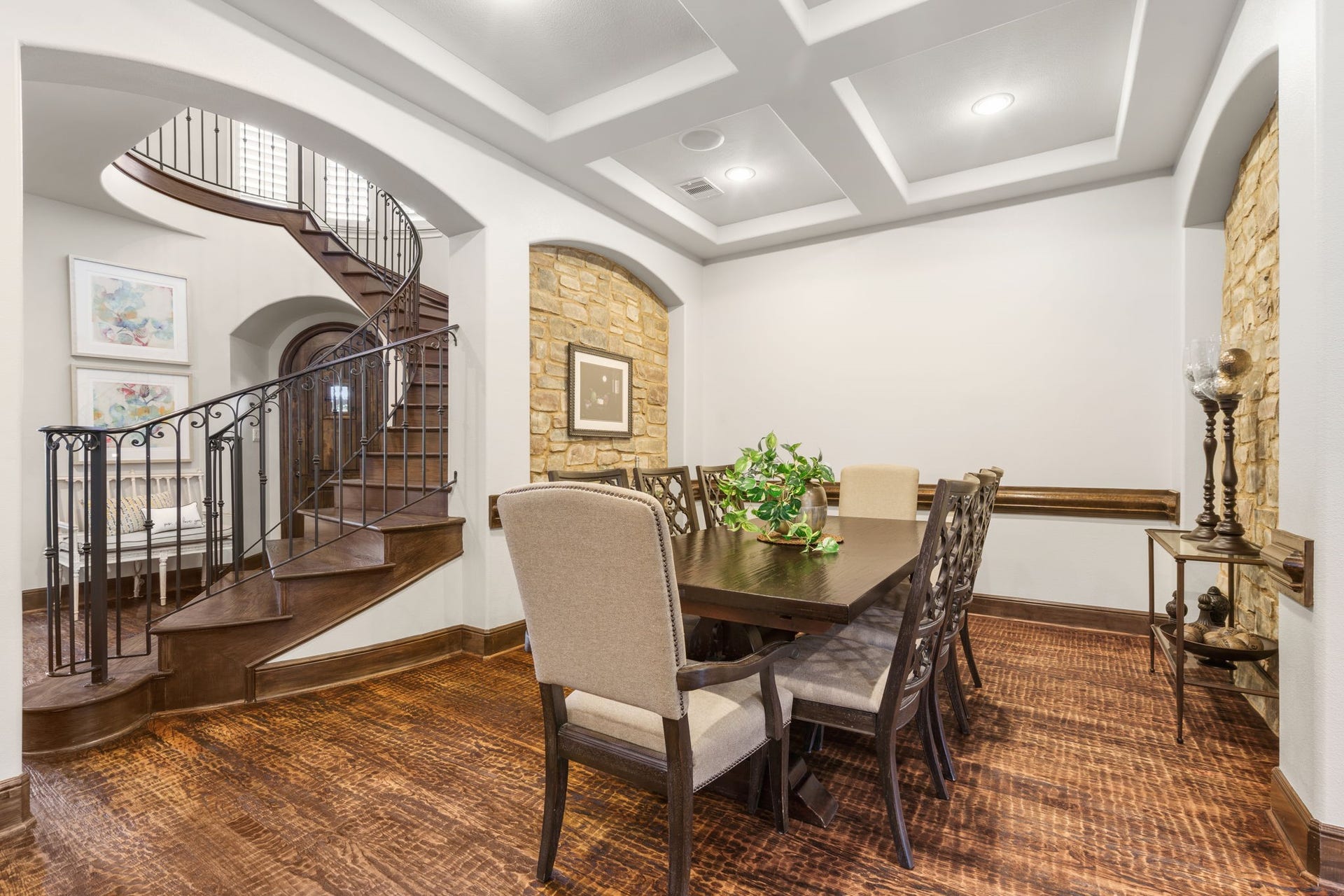 126 Summer Holly Drive, Conroe, TX 77384 Elegant formal dining room with a distinctive coffered ceiling, recessed lighting, and graceful arched openings.