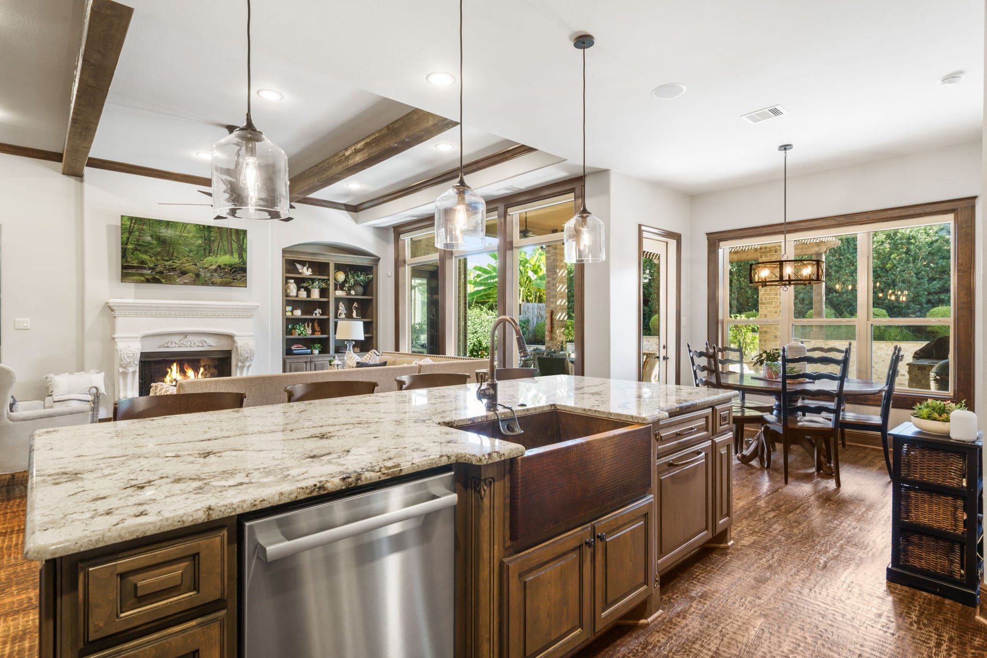126 Summer Holly Drive, Conroe, TX 77384 Spacious island with a distinctive farmhouse-style sink and dishwasher overlooks the family room and sunlit breakfast area.