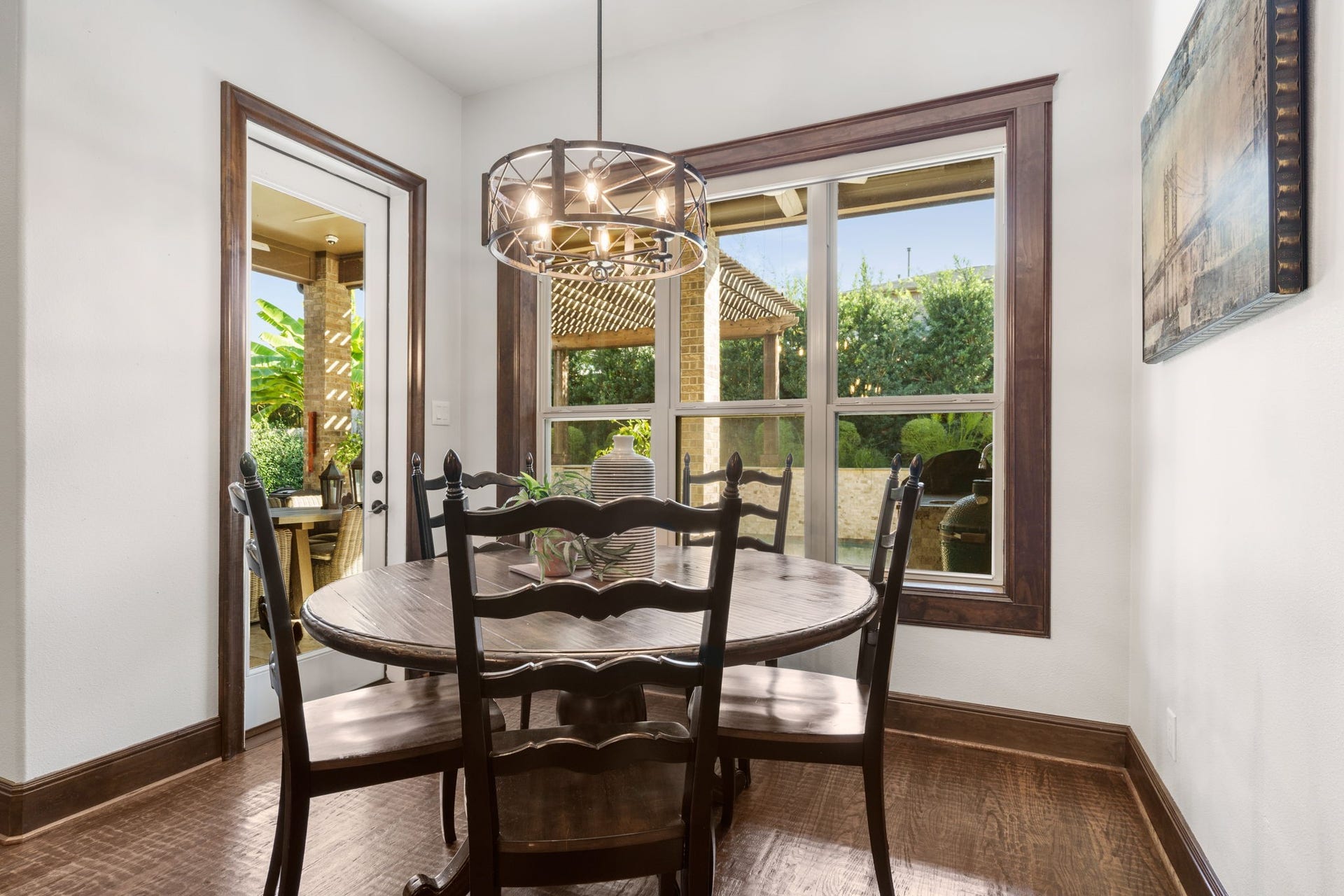 126 Summer Holly Drive, Conroe, TX 77384 Charming breakfast area with rich wood trim, abundant natural light, and lovely views of the outdoor living space.