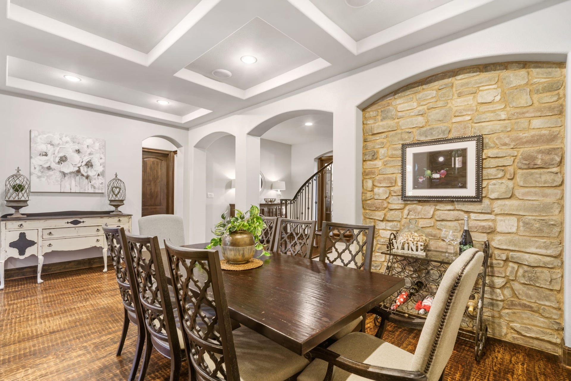 126 Summer Holly Drive, Conroe, TX 77384 Beautiful natural stone accent walls bring warmth and texture to this inviting dining space, ideal for hosting memorable gatherings.