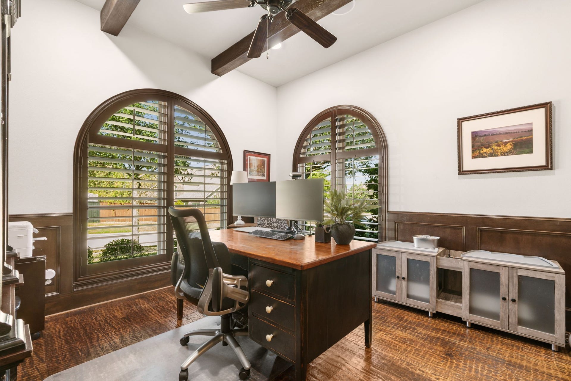 126 Summer Holly Drive, Conroe, TX 77384 Private home office featuring stunning arched windows with plantation shutters, exposed ceiling beams, and abundant natural light.