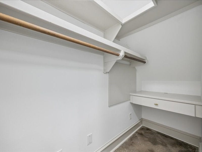 Room to organize and space to work! Two large walk-in closets offer generous storage, including one within the laundry room, where a second built-in desk occupies a handy back nook. The other closet features double hanging rods to maximize wardrobe space.