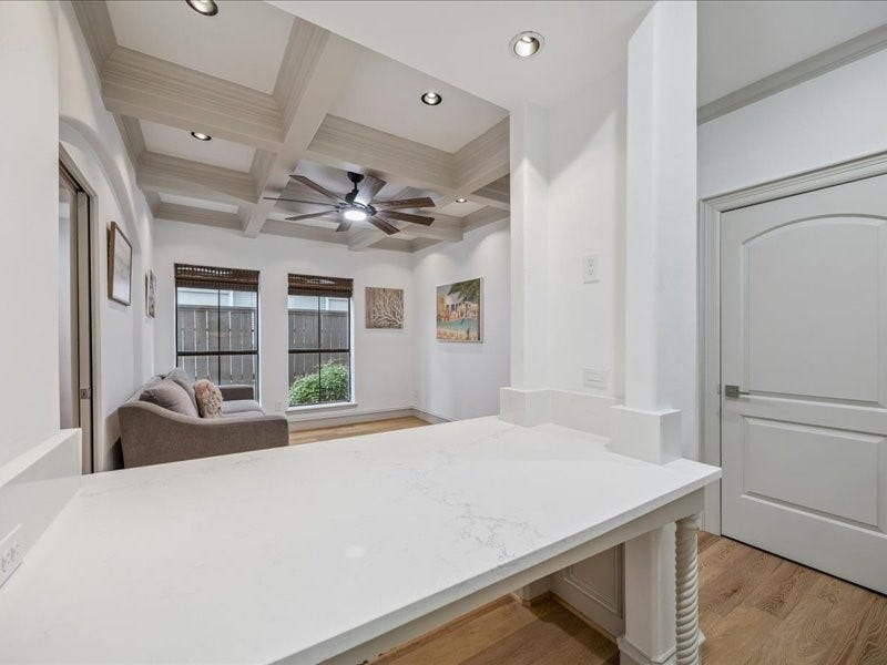 Relax, work, and stay organized in this inviting living area, featuring a built-in desk, a built-in dresser, and a spacious walk-in closet. Thoughtful storage keeps your essentials tucked away and your living space ready to enjoy!