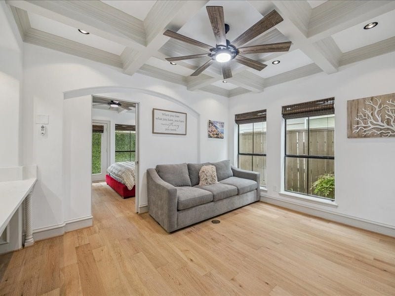 Relax, work, and stay organized in this inviting living area, featuring a built-in desk, a built-in dresser, and a spacious walk-in closet. Thoughtful storage keeps your essentials tucked away and your living space ready to enjoy!