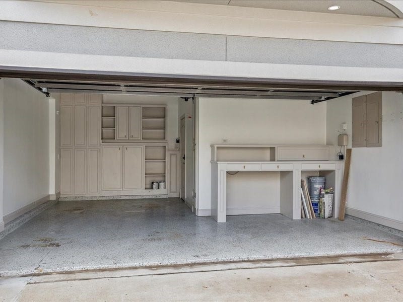 A place for everything! This garage view showcases storage along the entire back wall, a handy workbench, and additional shelving. From tools and hobby supplies to seasonal dcor, theres plenty of room to keep everything organized.
