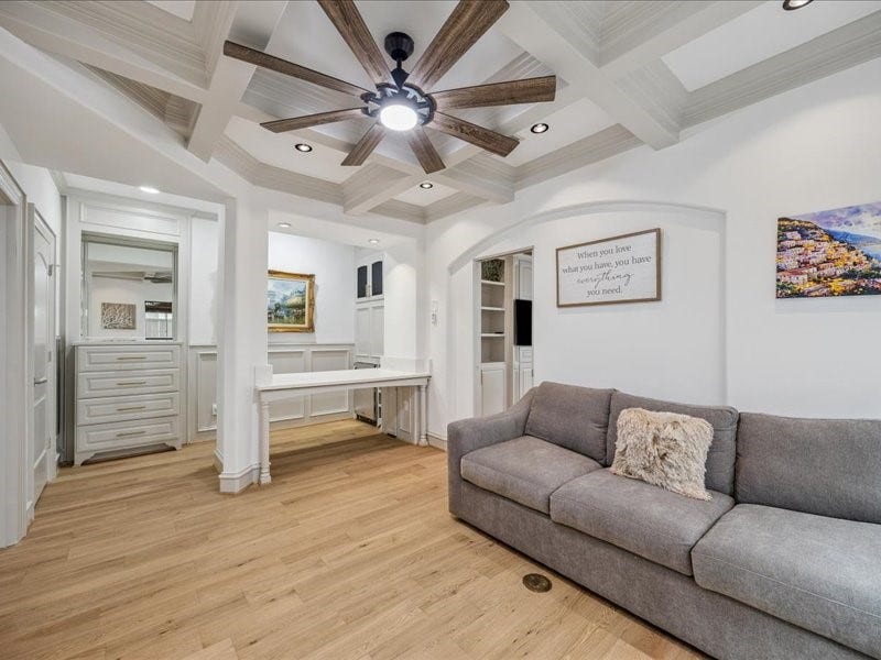 Relax, work, and stay organized in this inviting living area, featuring a built-in desk, a built-in dresser, and a spacious walk-in closet. Thoughtful storage keeps your essentials tucked away and your living space ready to enjoy!