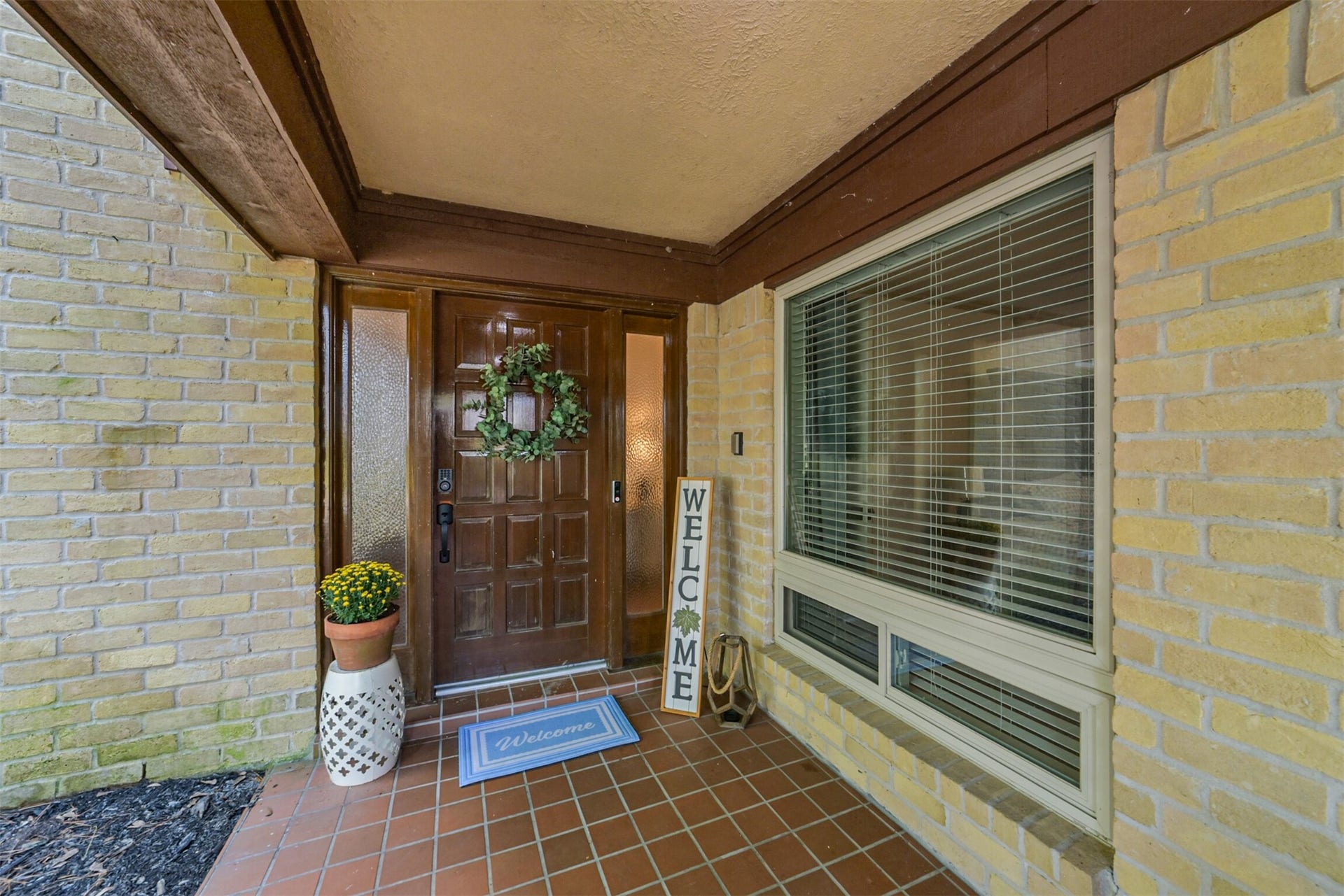 7618 Hurst Forest Drive, Humble, TX 77346 A sheltered entry, warm brick, and a classic wood door offer a welcoming first impression. The covered doorstep provides a comfortable place to greet guests and protection from the weather as you come and go.