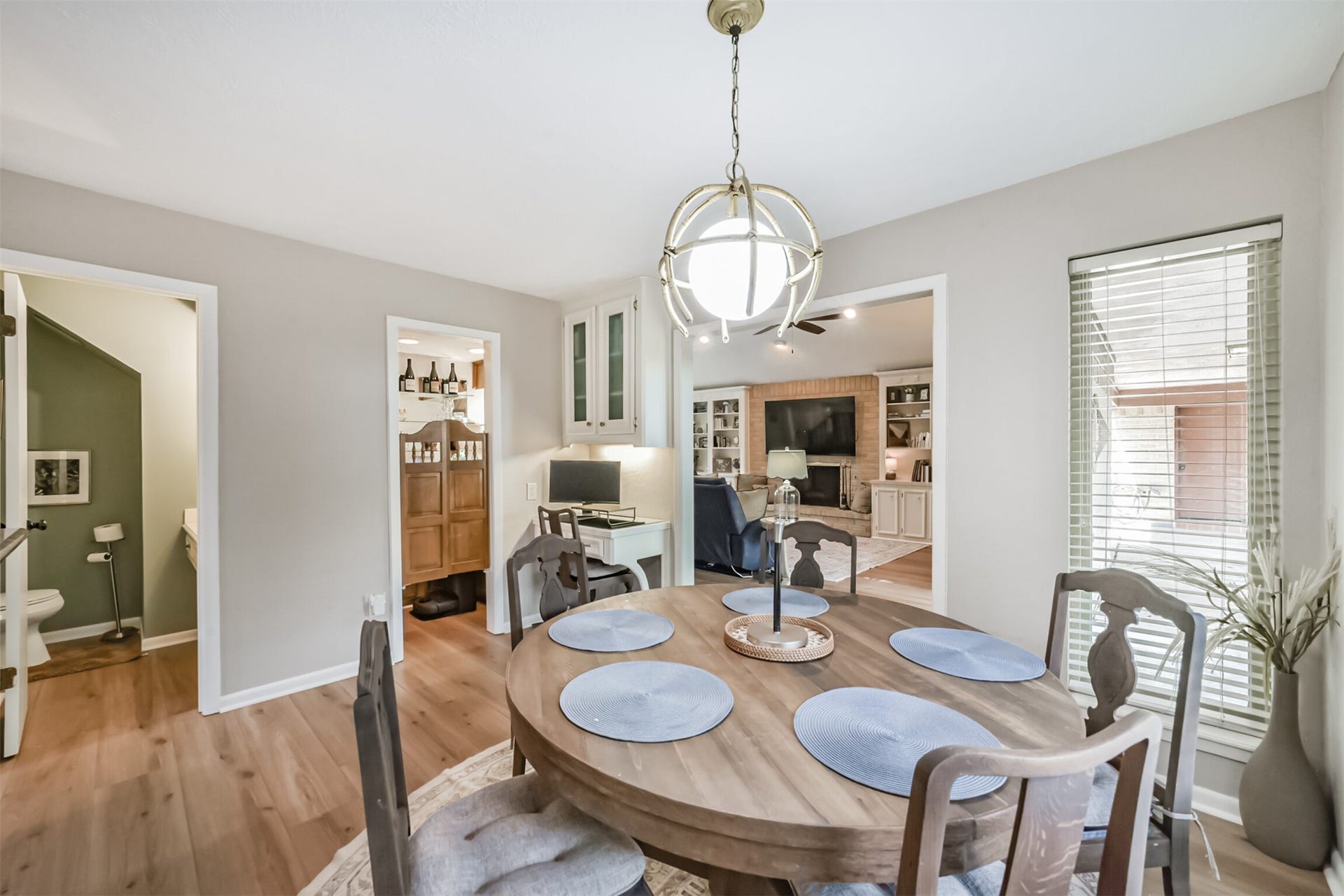 7618 Hurst Forest Drive, Humble, TX 77346 This inviting dining space connects easily to the living room, allowing guests to gather without feeling separated. Natural light and warm flooring create a relaxed setting for weeknight dinners or lingering weekend breakfasts.