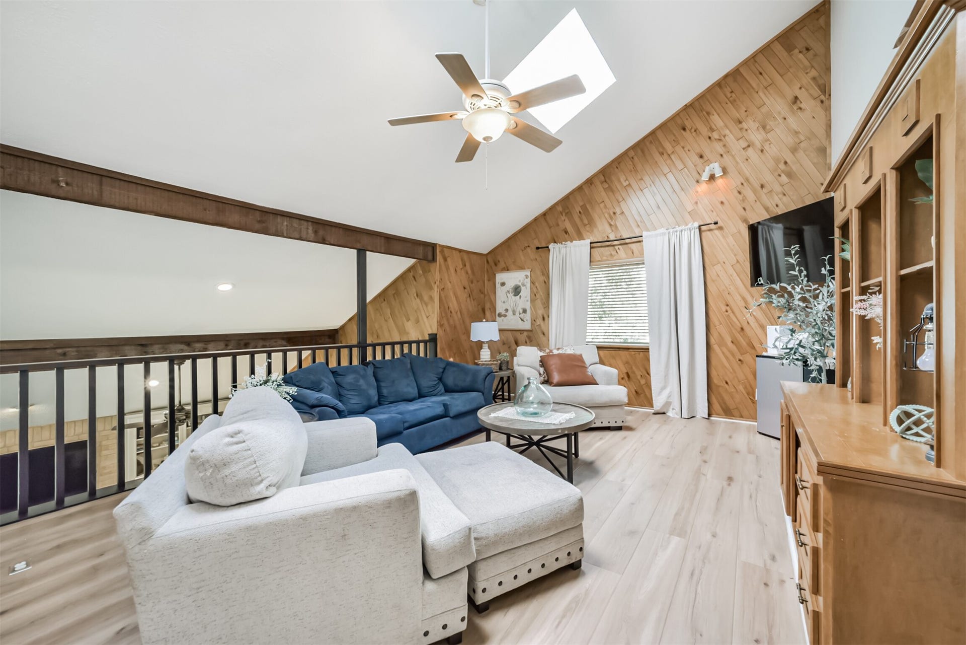 7618 Hurst Forest Drive, Humble, TX 77346 An airy upstairs loft offers a second gathering space for movie nights, reading, or casual conversation. Vaulted ceilings, exposed beams, and warm wood accents carry the homes distinctive character upstairs.