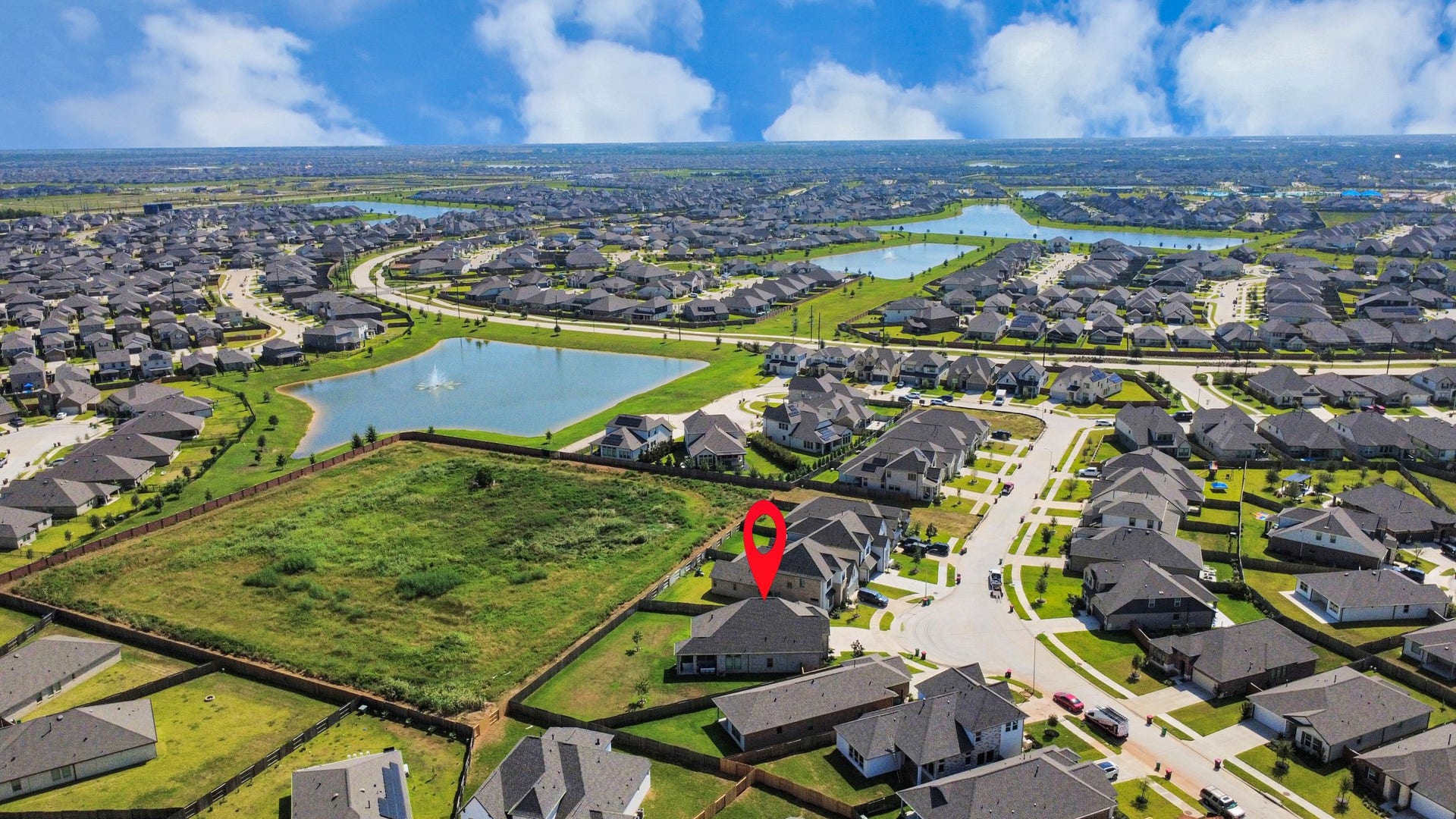2995 Tantara Drive, Katy, TX 77493 Charming home nestled in a vibrant neighborhood with scenic views of nearby lakes and green spaces, offering a serene and picturesque setting.