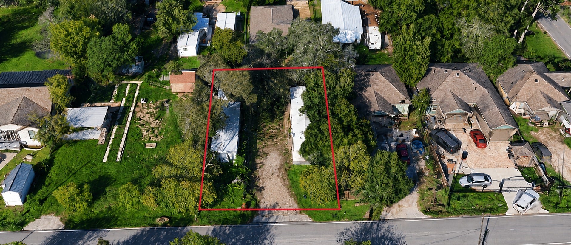 Aerial view highlighting the propertys approximately 76 ft x 110 ft lot.