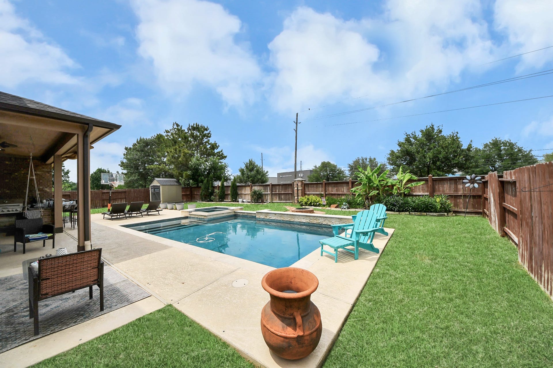 14926 Dogwood View Lane, Cypress, TX 77429 Relax in your private backyard oasis including a pool, spa, outdoor kitchen and plenty of seating to sunbathe of host your loved ones!