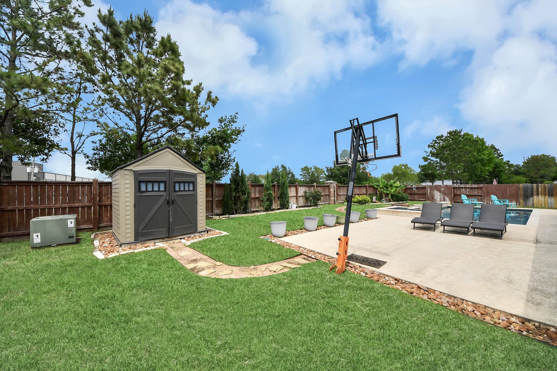 14926 Dogwood View Lane, Cypress, TX 77429 Relax in your private backyard oasis including a pool, spa, outdoor kitchen and plenty of seating to sunbathe of host your loved ones!